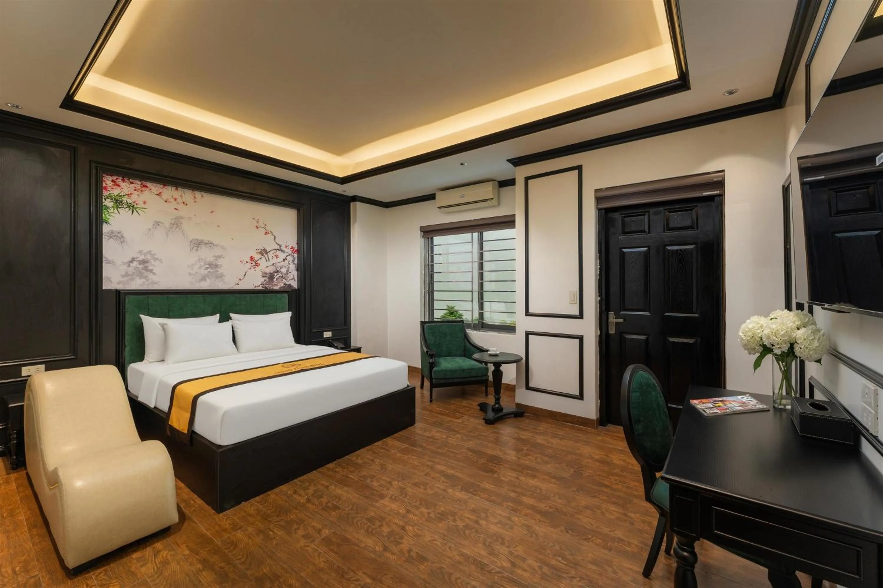 Communal lounge/ TV room, Bed in Grand Hanoi Boutique Hotel