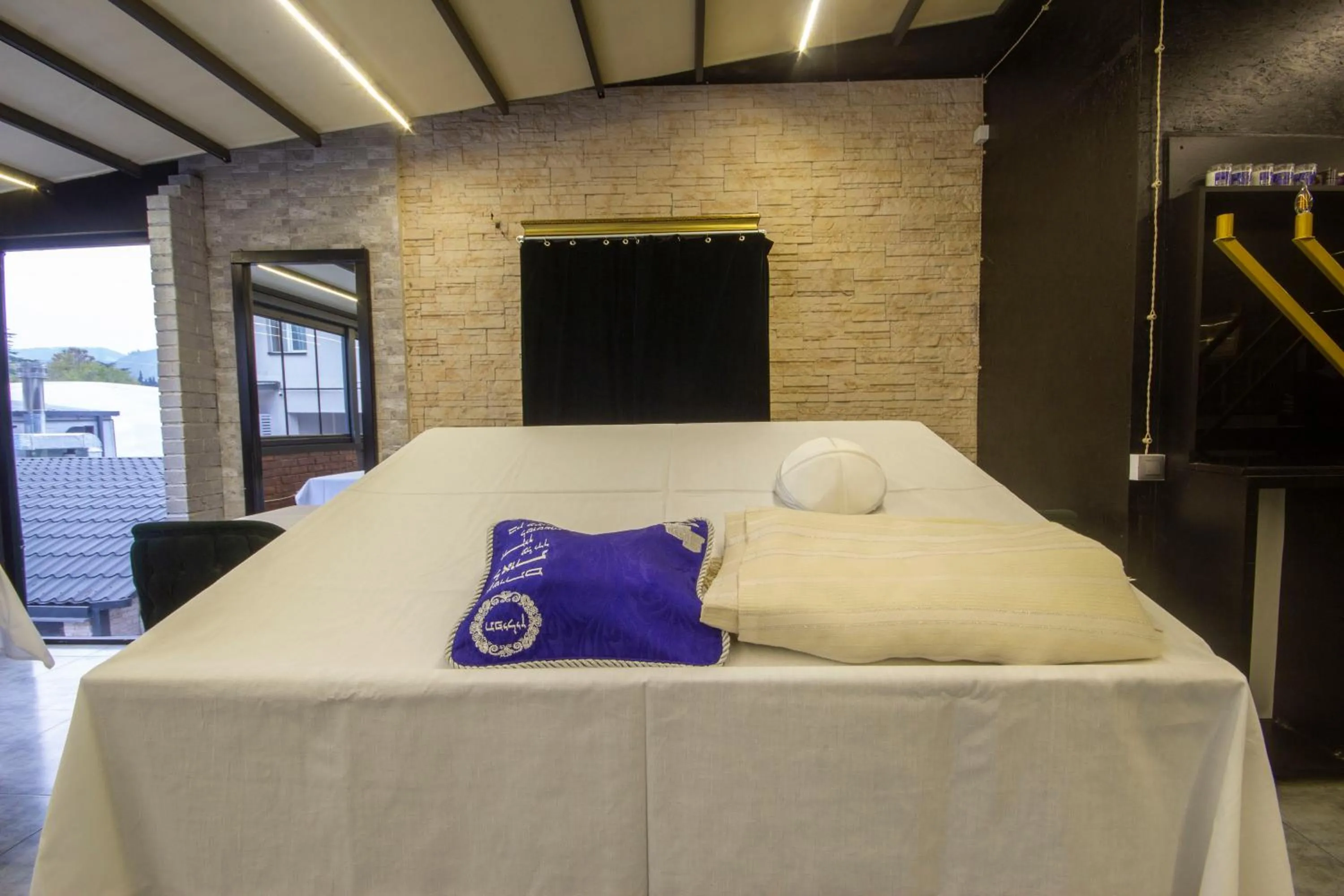 Seating area, Bed in Kinor David Glatt Kosher Hotel