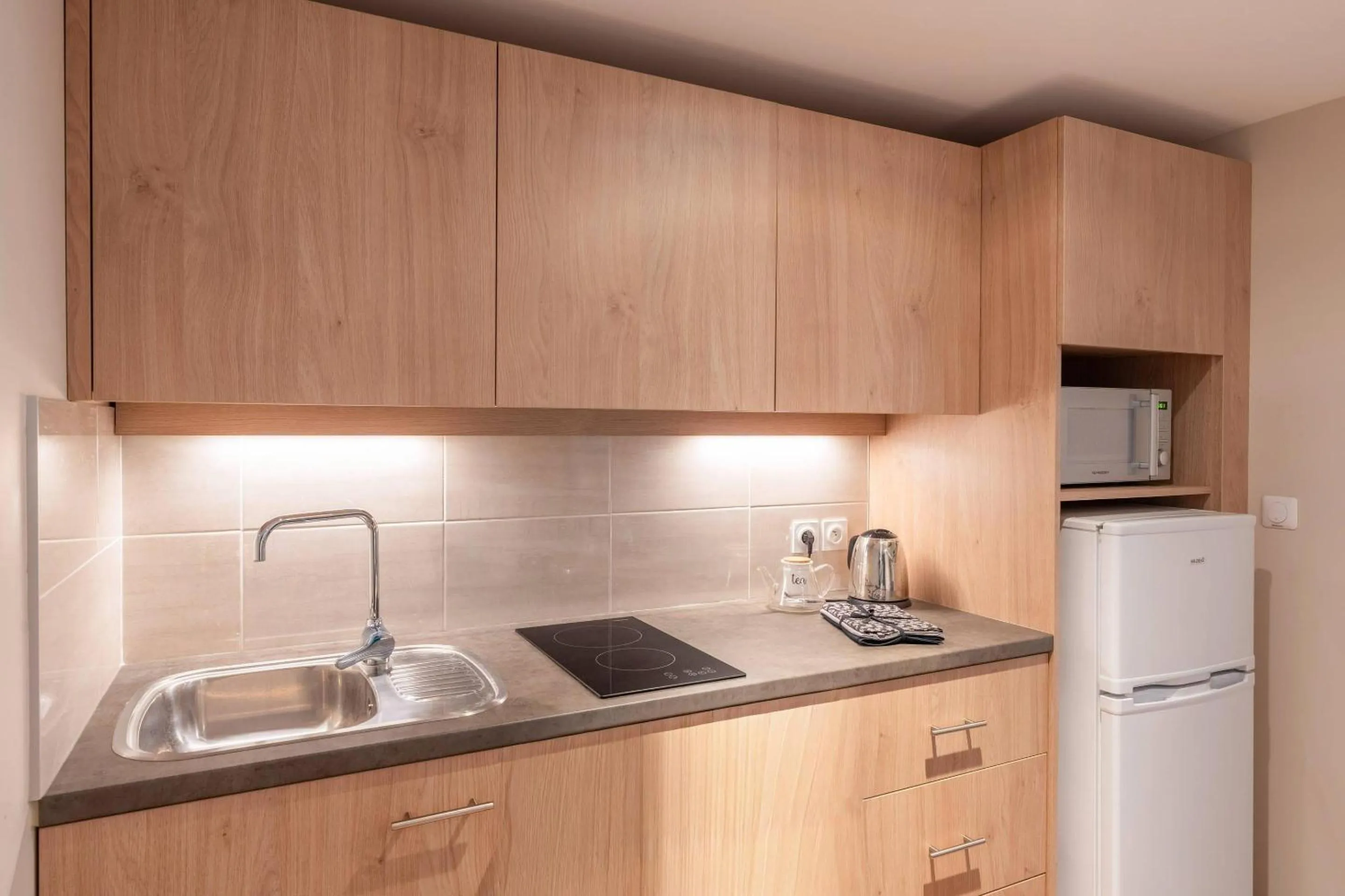 Kitchen or kitchenette in Quality Aparthotel Toulouse Ponts Jumeaux