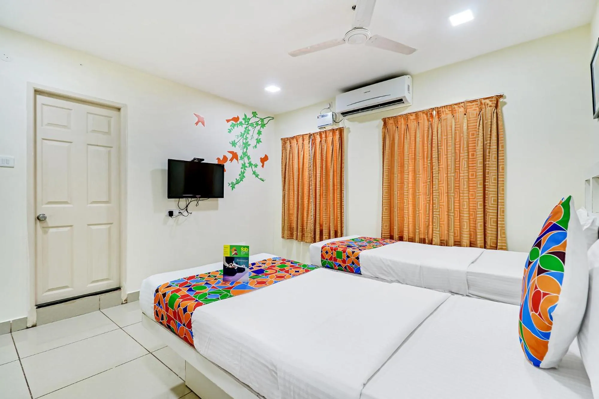 Bed in Fabhotel Colors Service Apartment - Nr MRC Nagar
