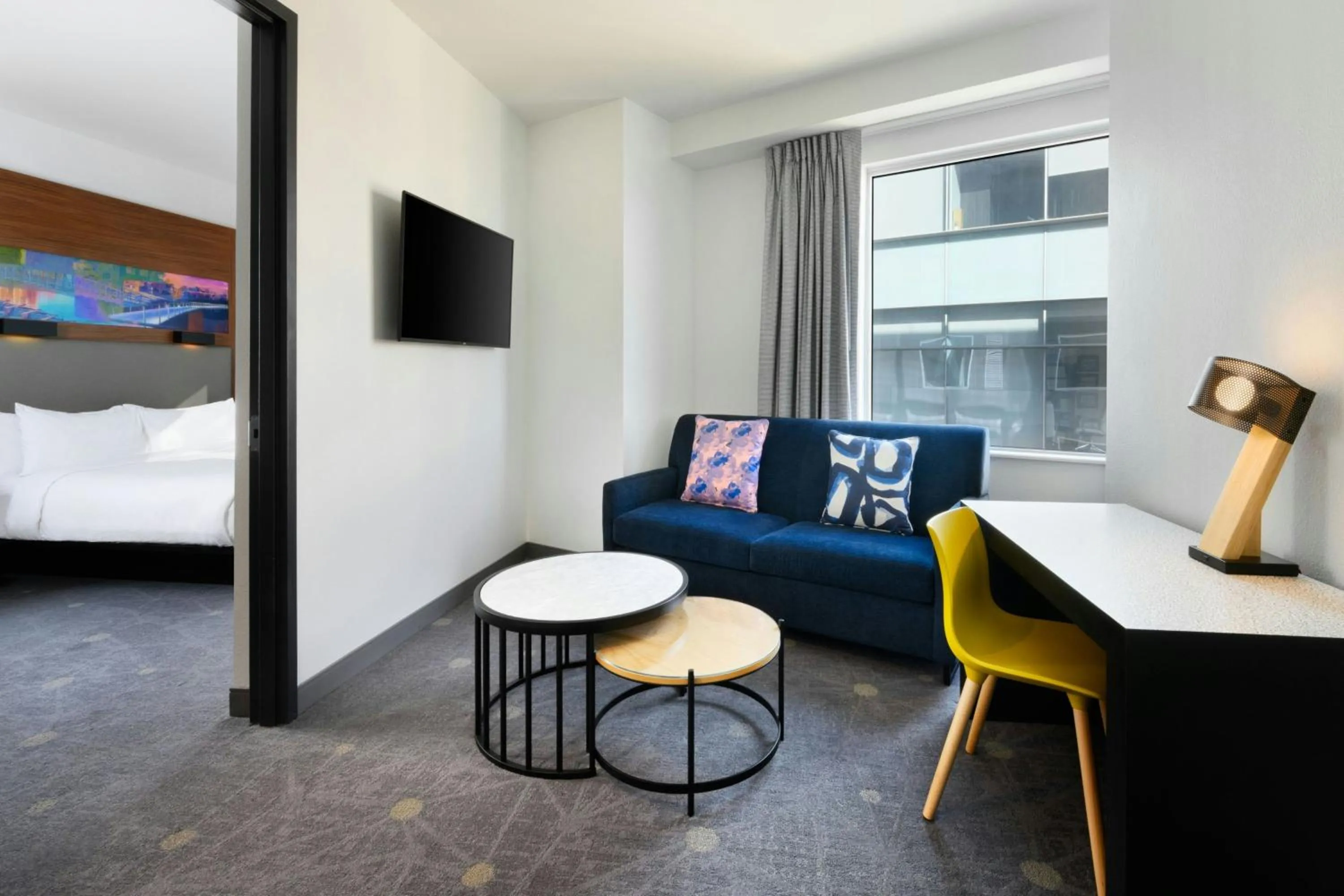 Living room, Bed in Aloft Greenville Downtown