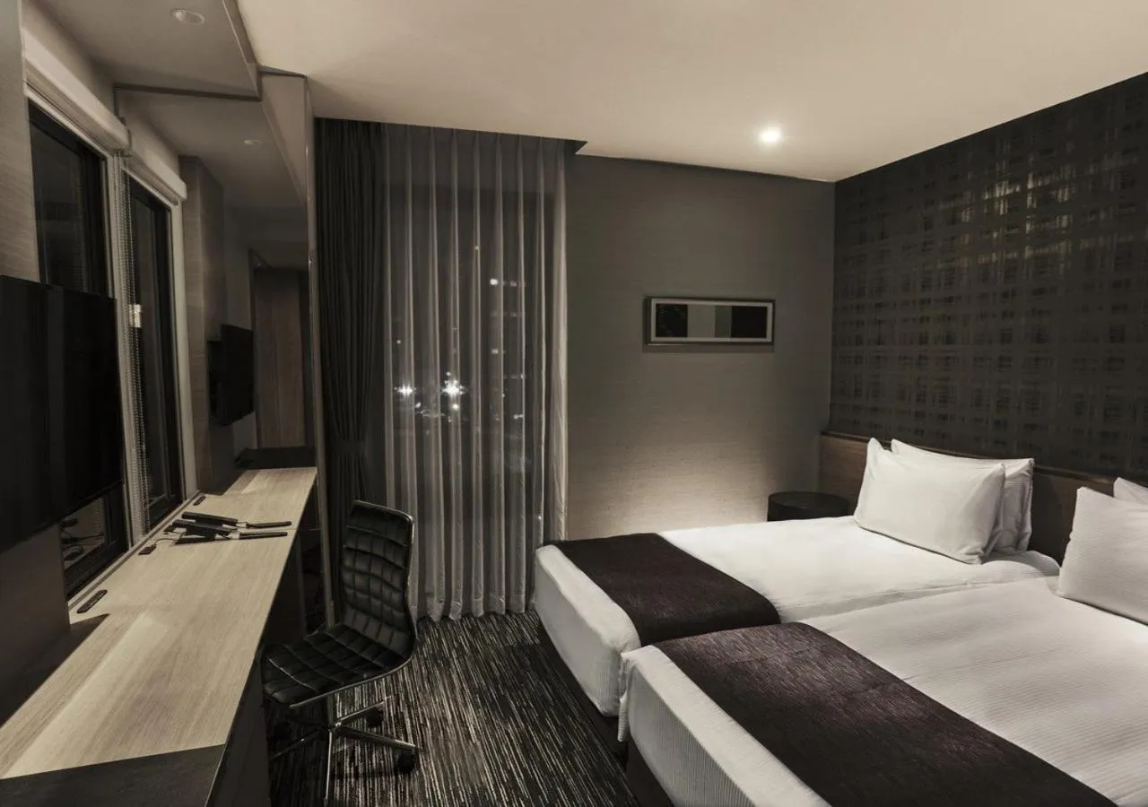 Photo of the whole room, Bed in The Strings Hotel Nagoya