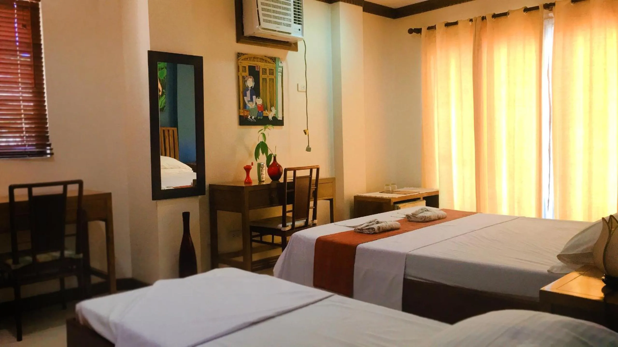 Bed in The Beach House Carabao Island