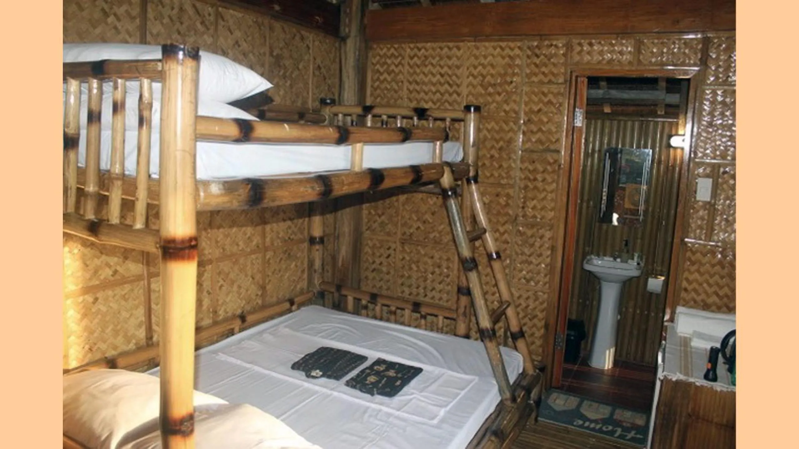 Bed in The Beach House Carabao Island