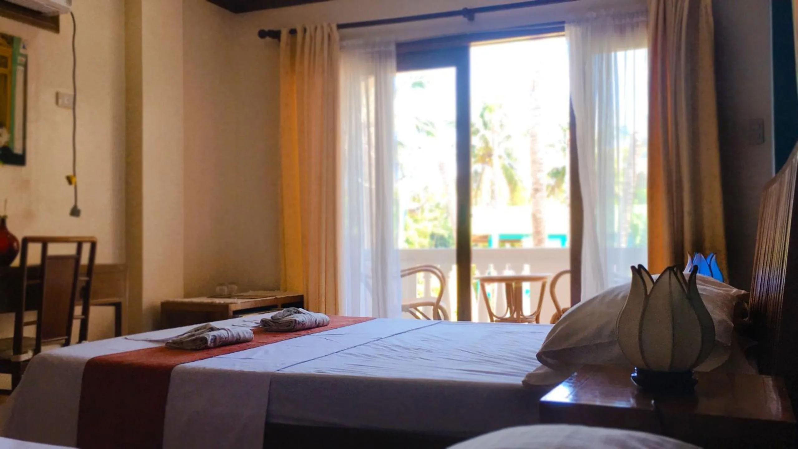 Bed in The Beach House Carabao Island