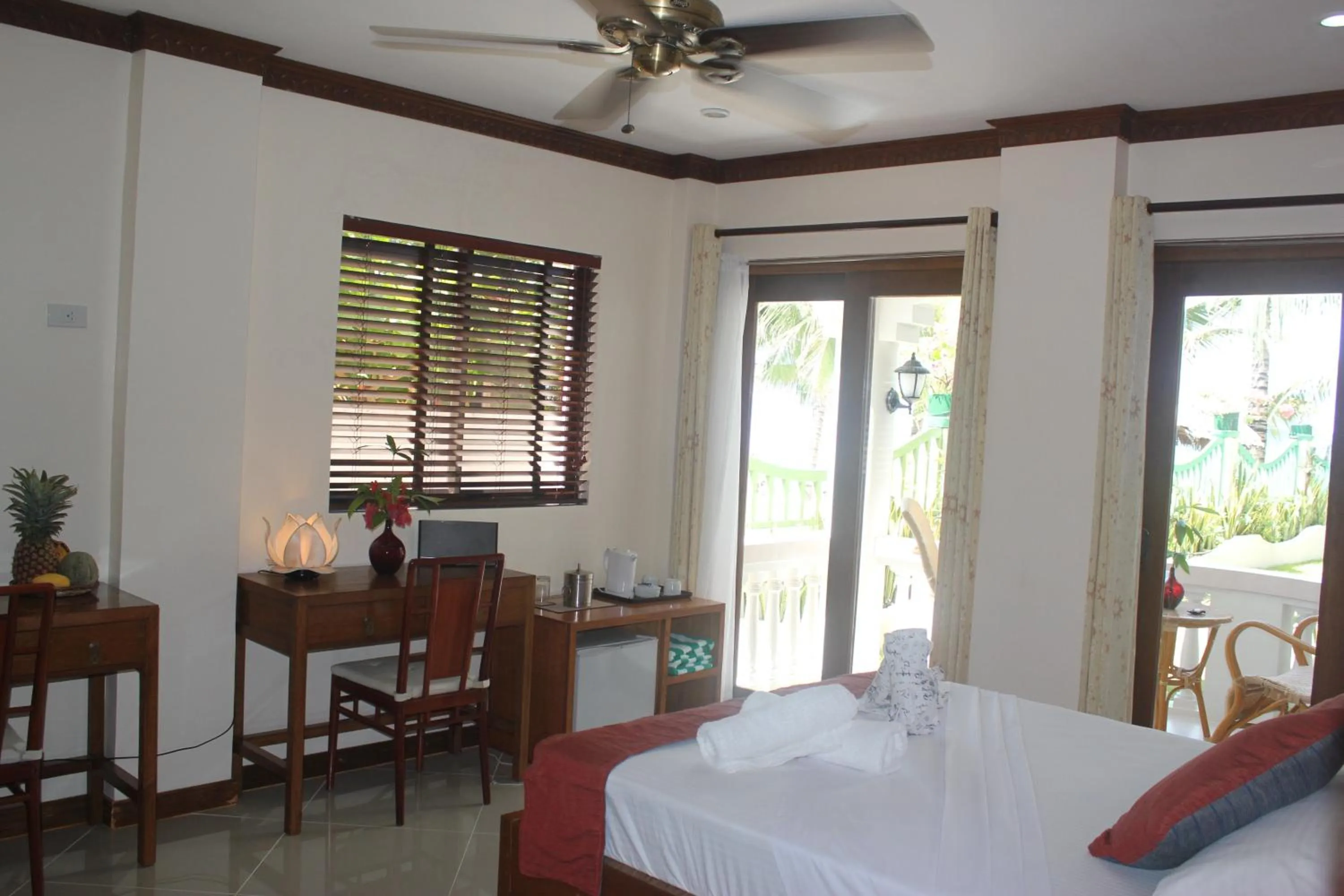 Bed in The Beach House Carabao Island