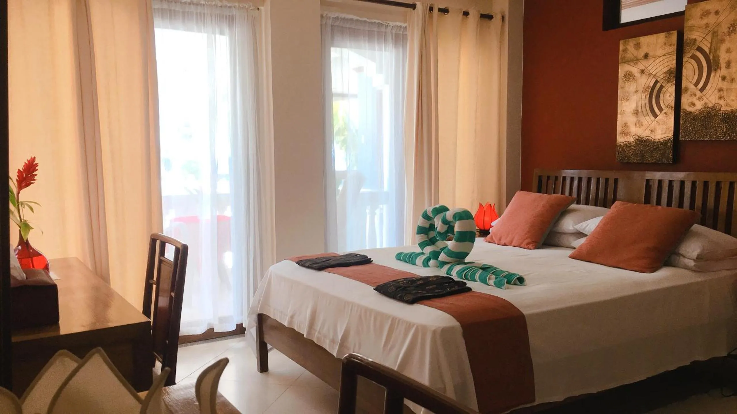 Photo of the whole room, Bed in The Beach House Carabao Island