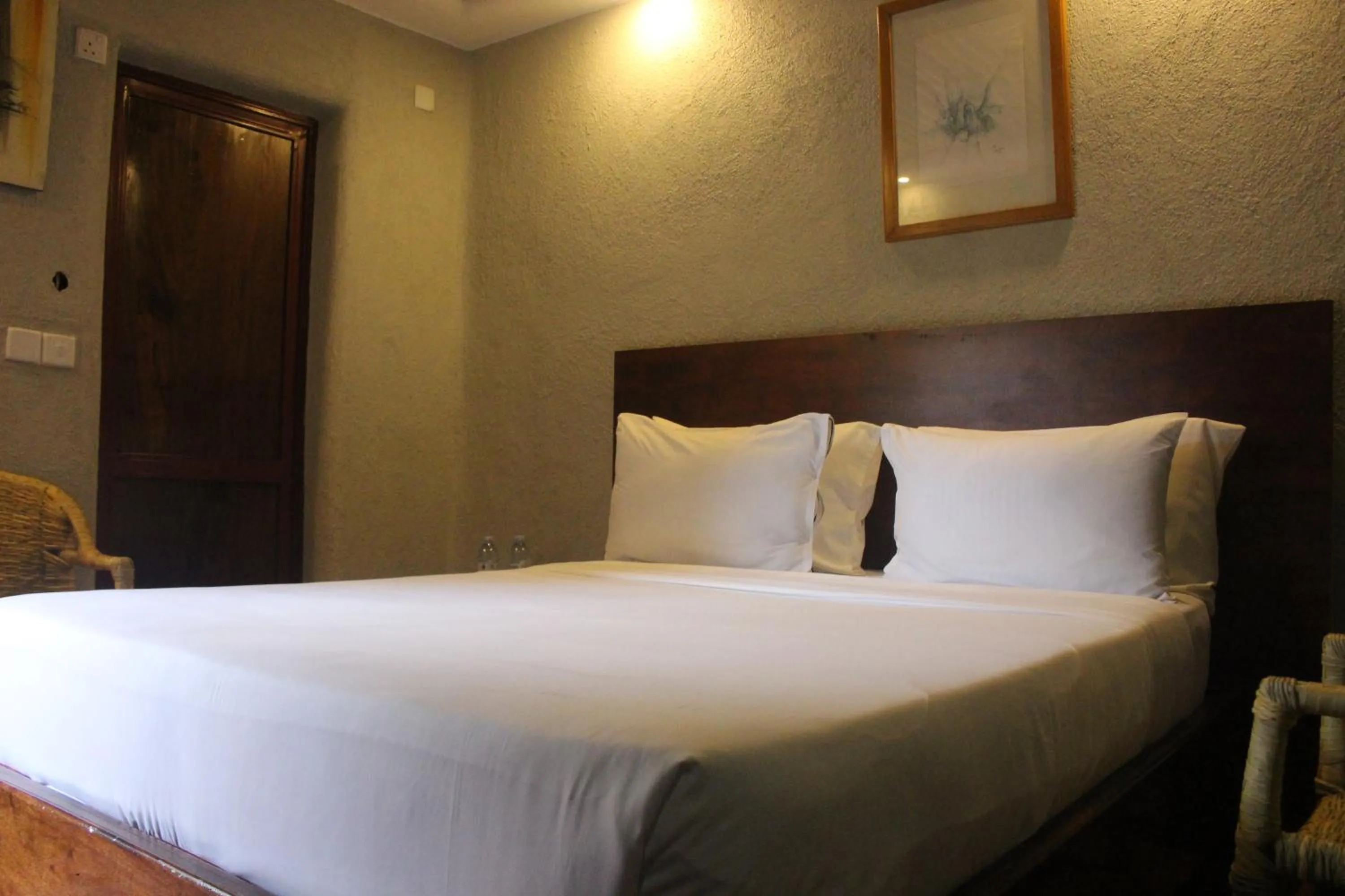 Bed in Montane Safaris Hotel, Entebbe