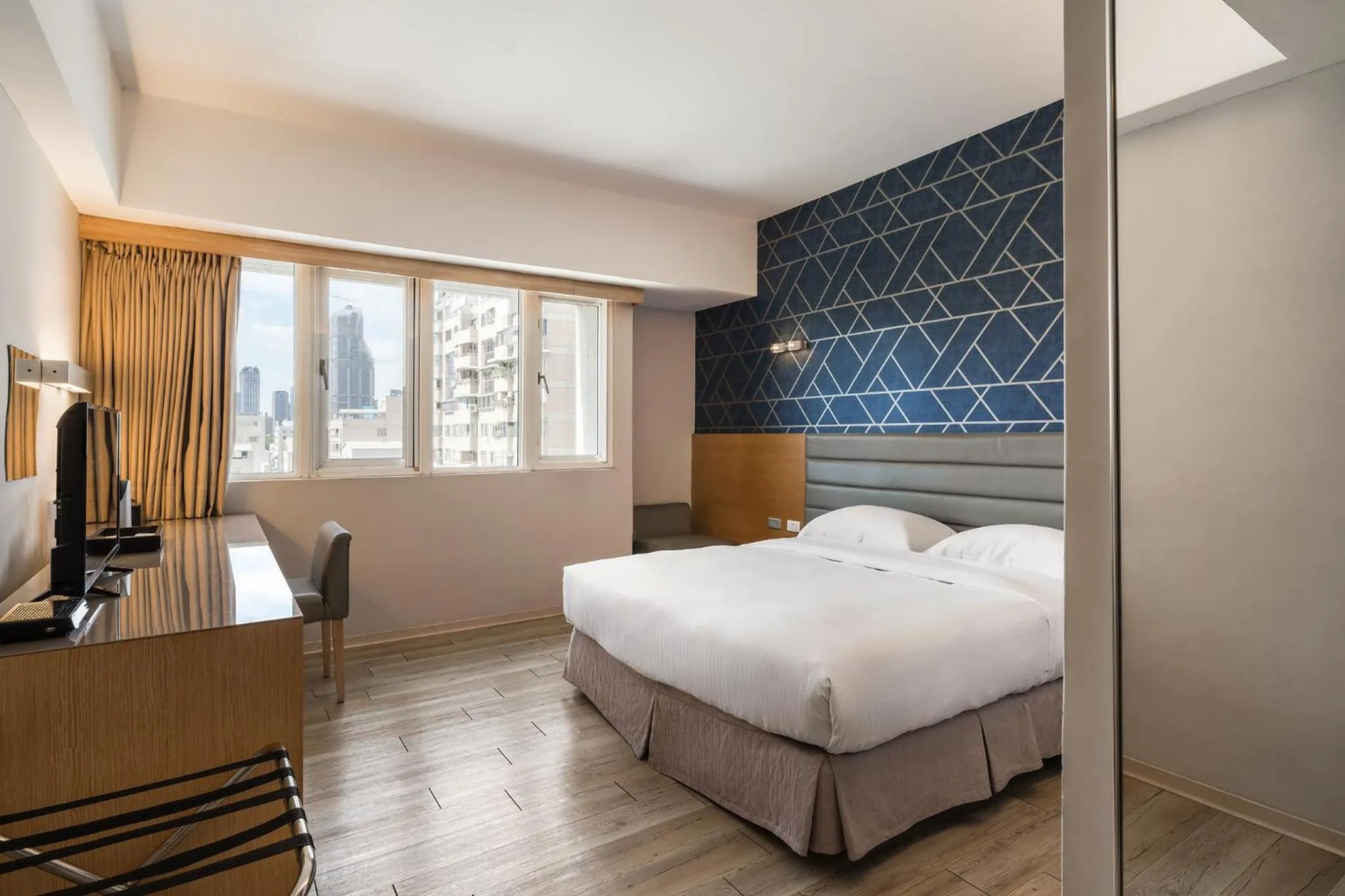 Bed in The Riverside Hotel Esthetics