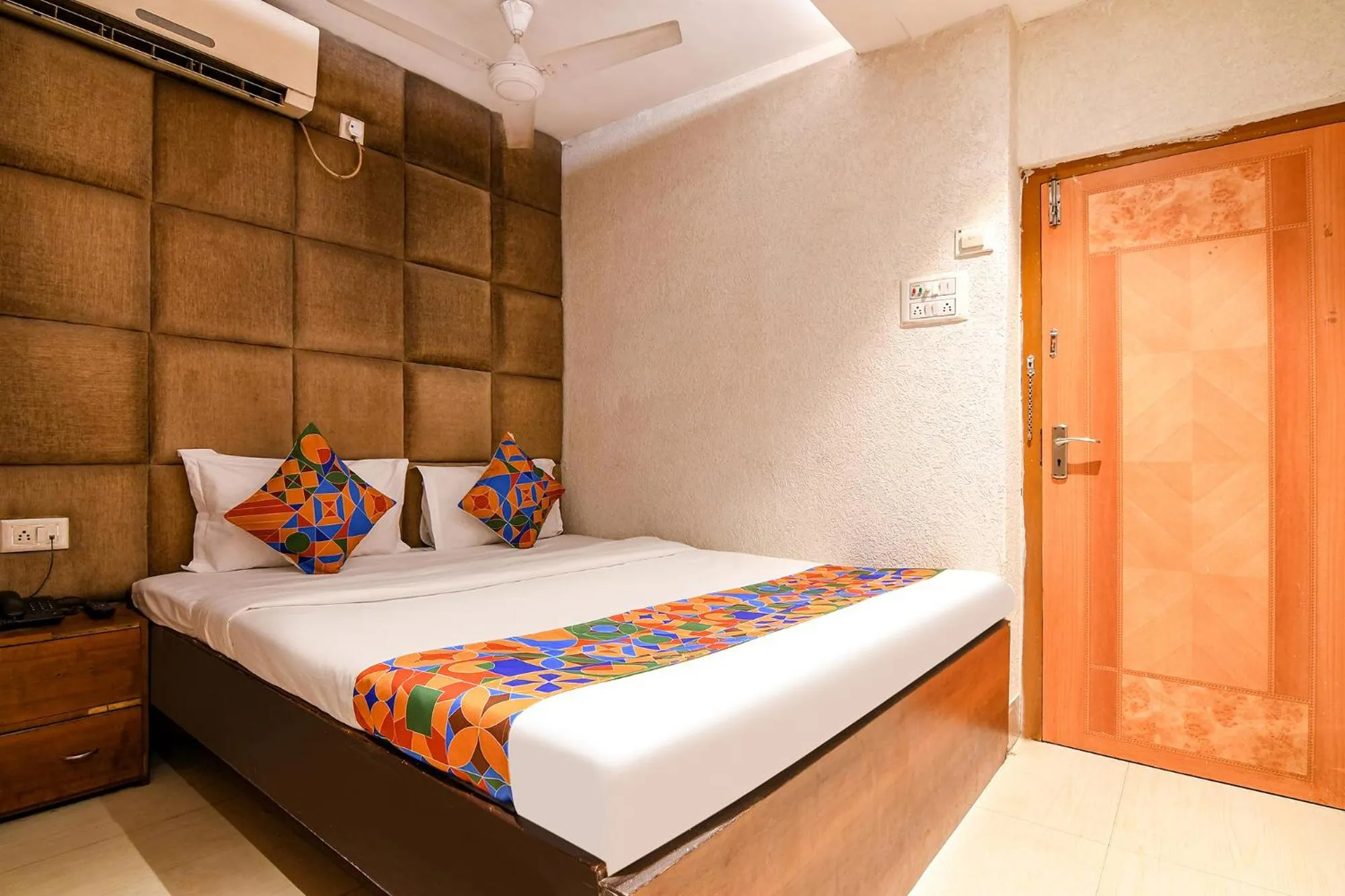 Bed in FabHotel Marina