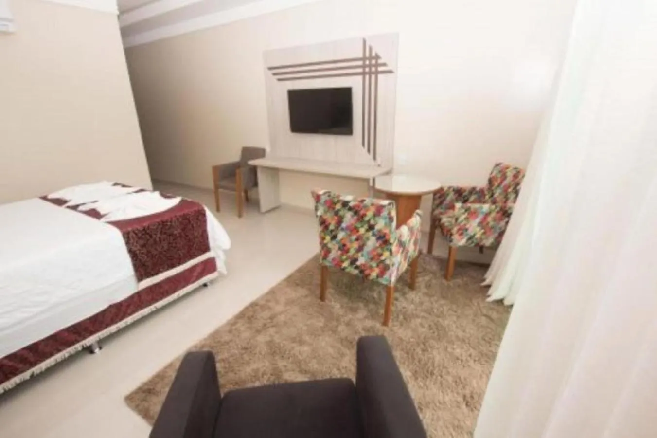 Communal lounge/ TV room, Bed in Hotel Vale Do Xingu