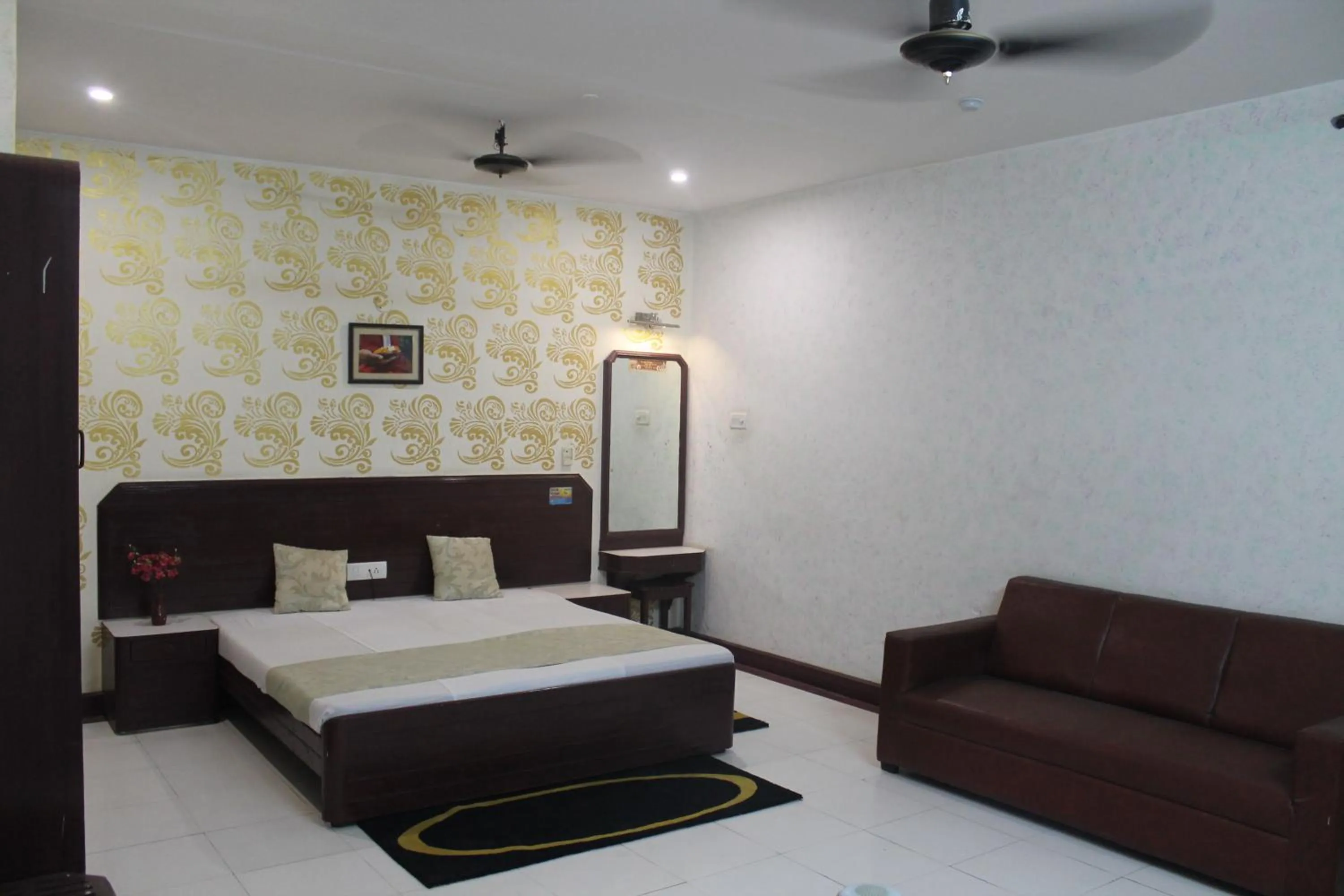 Photo of the whole room, Bed in Hotel Padmini International- Sigra