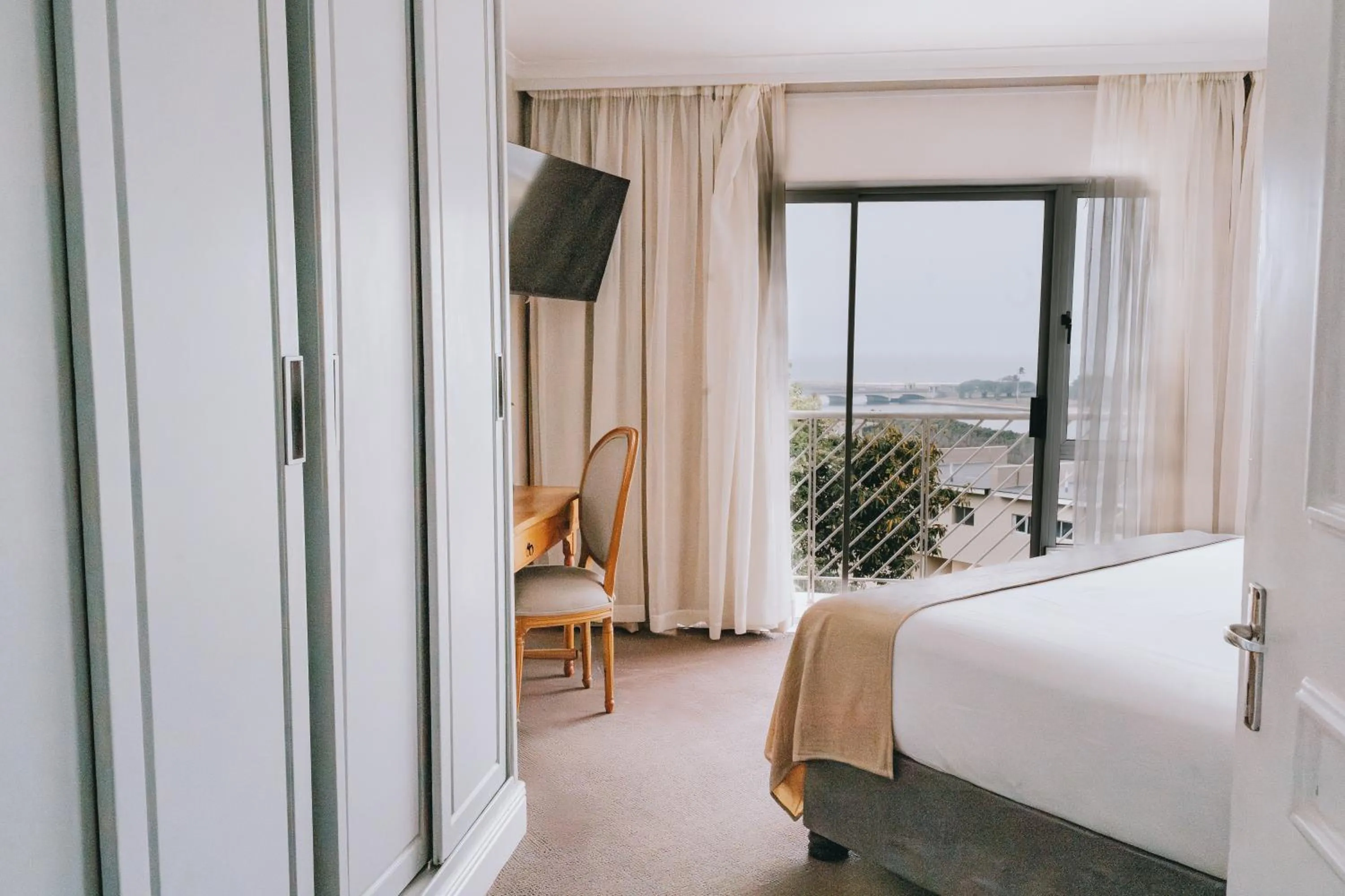 Bed in The Riverside Hotel