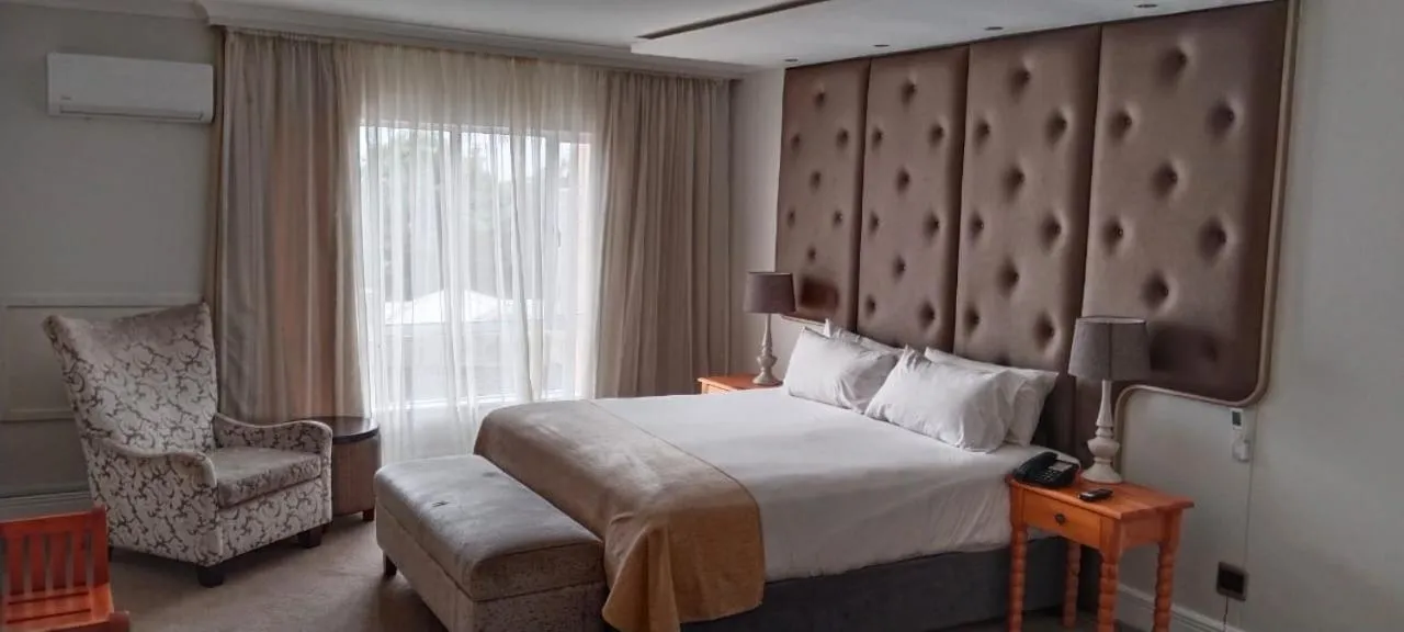 Bed in The Riverside Hotel