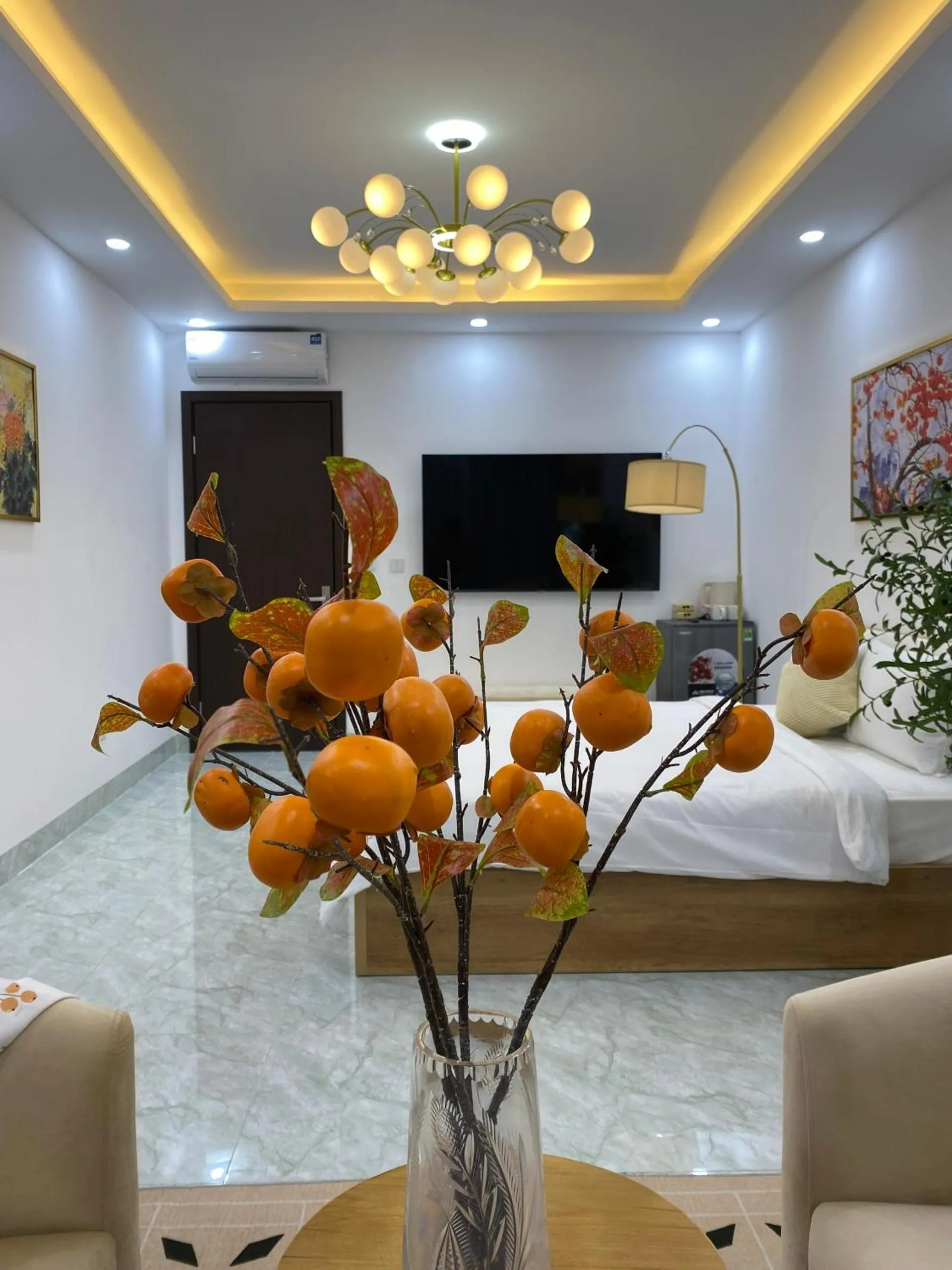 Communal lounge/ TV room in Grand C Homestay