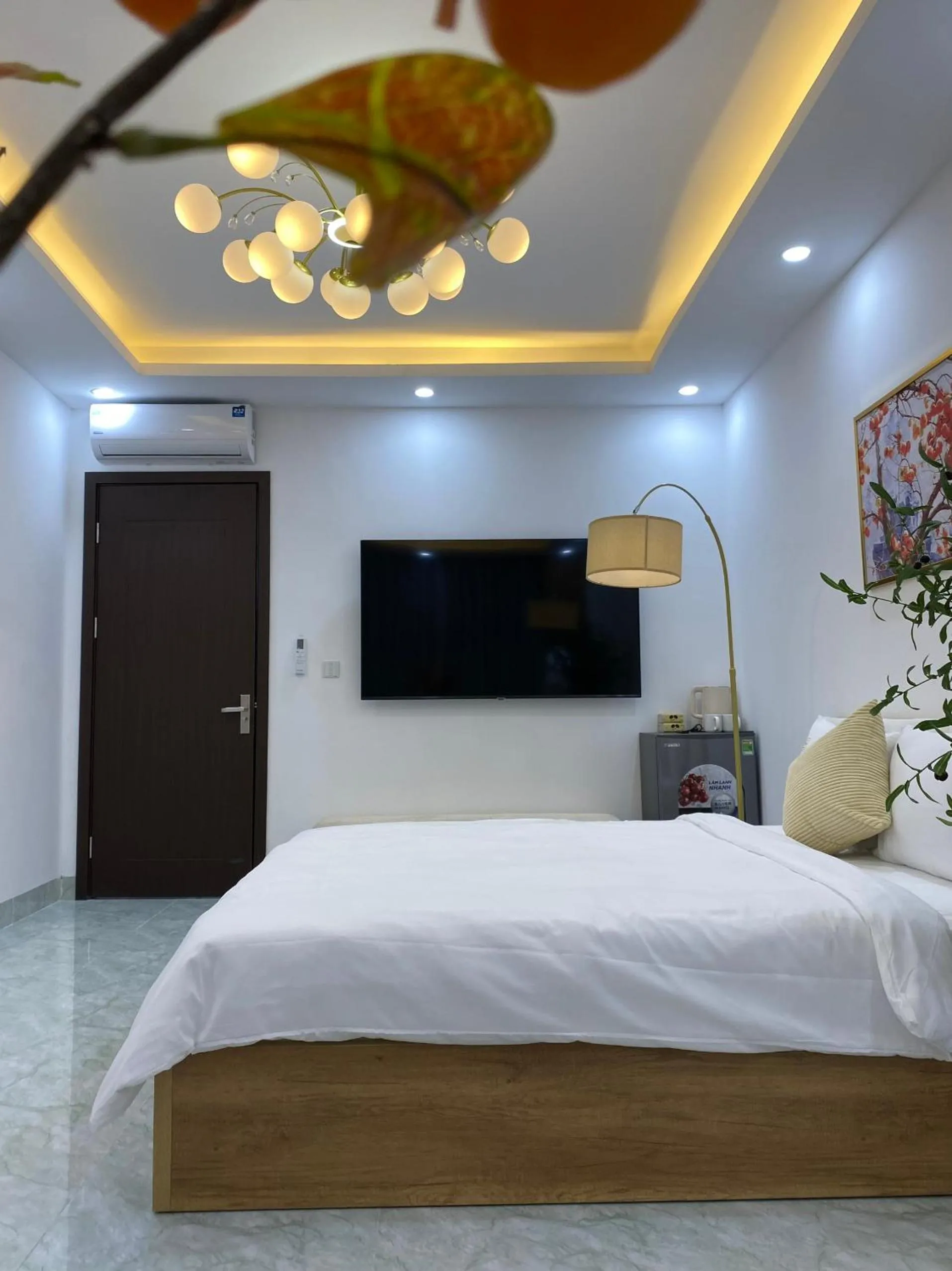 Communal lounge/ TV room, Bed in Grand C Homestay