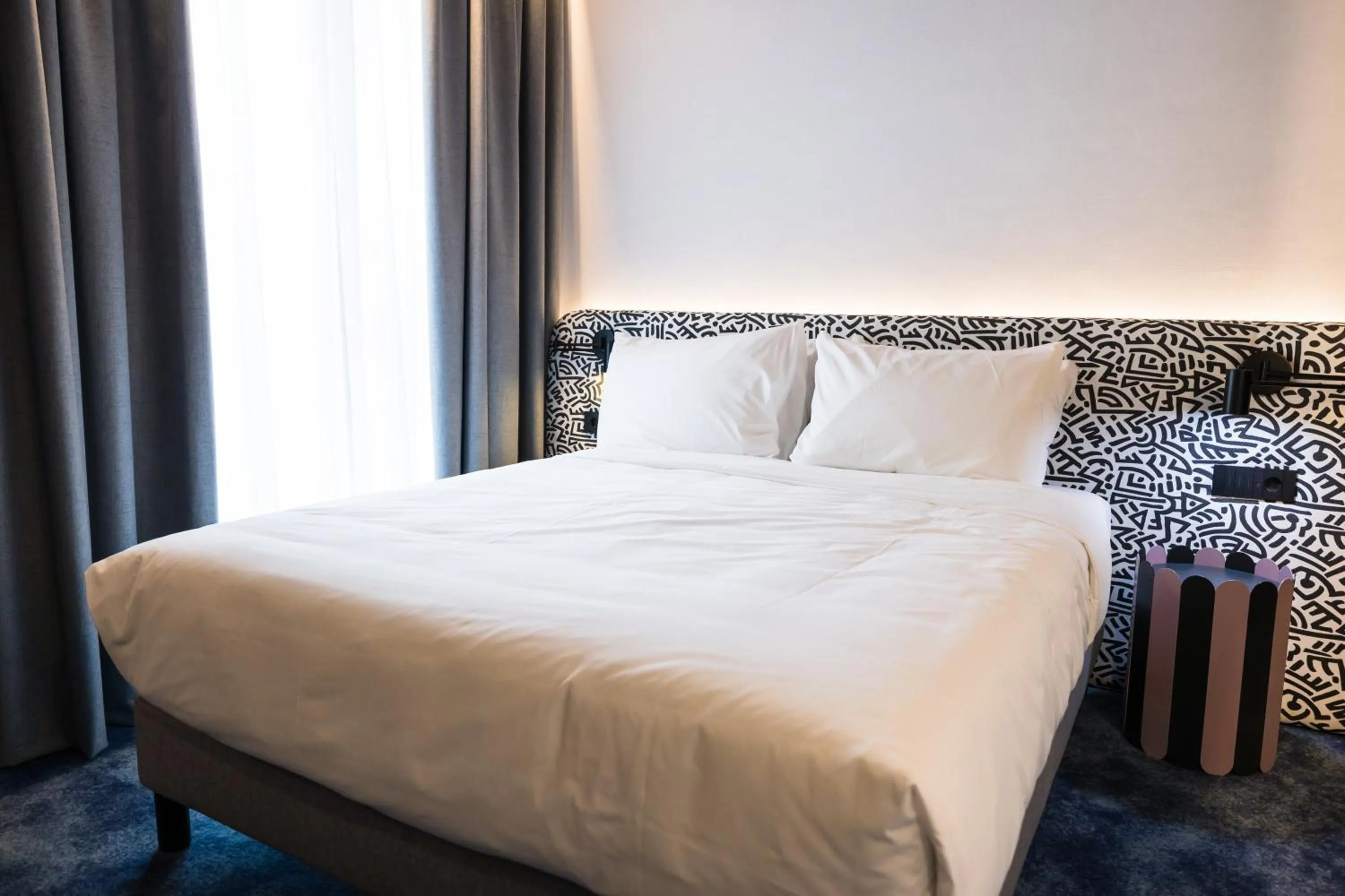 Bed in Mercure Bucharest Cantemir