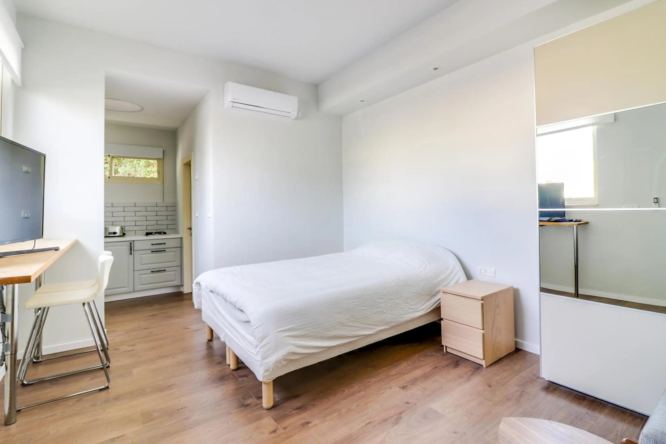 Bed in Carmel Boutique Apartments