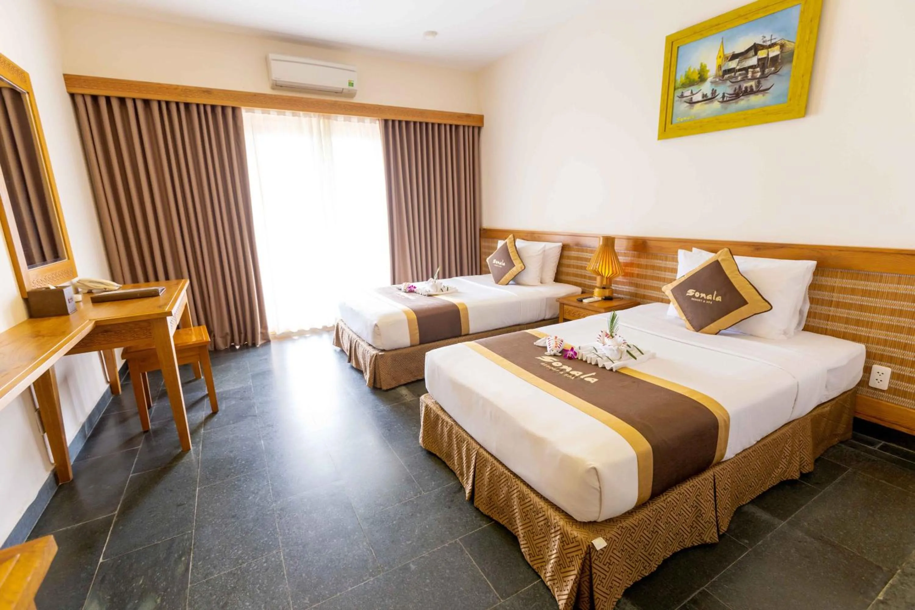 Bed in Sonata Resort & Spa