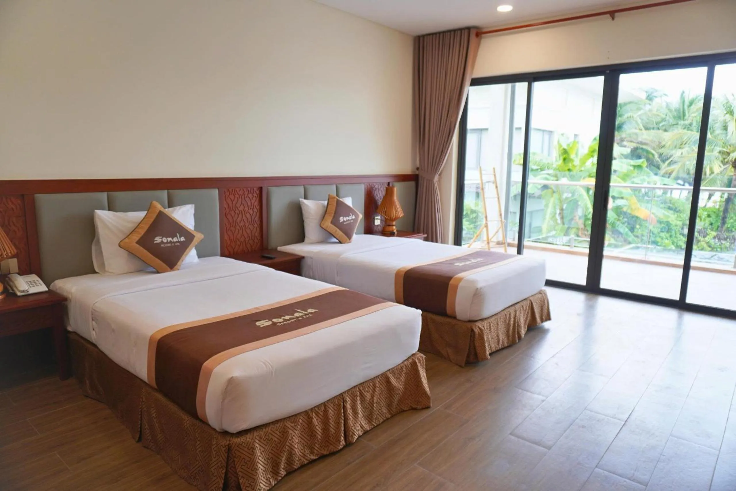 Bed in Sonata Resort & Spa