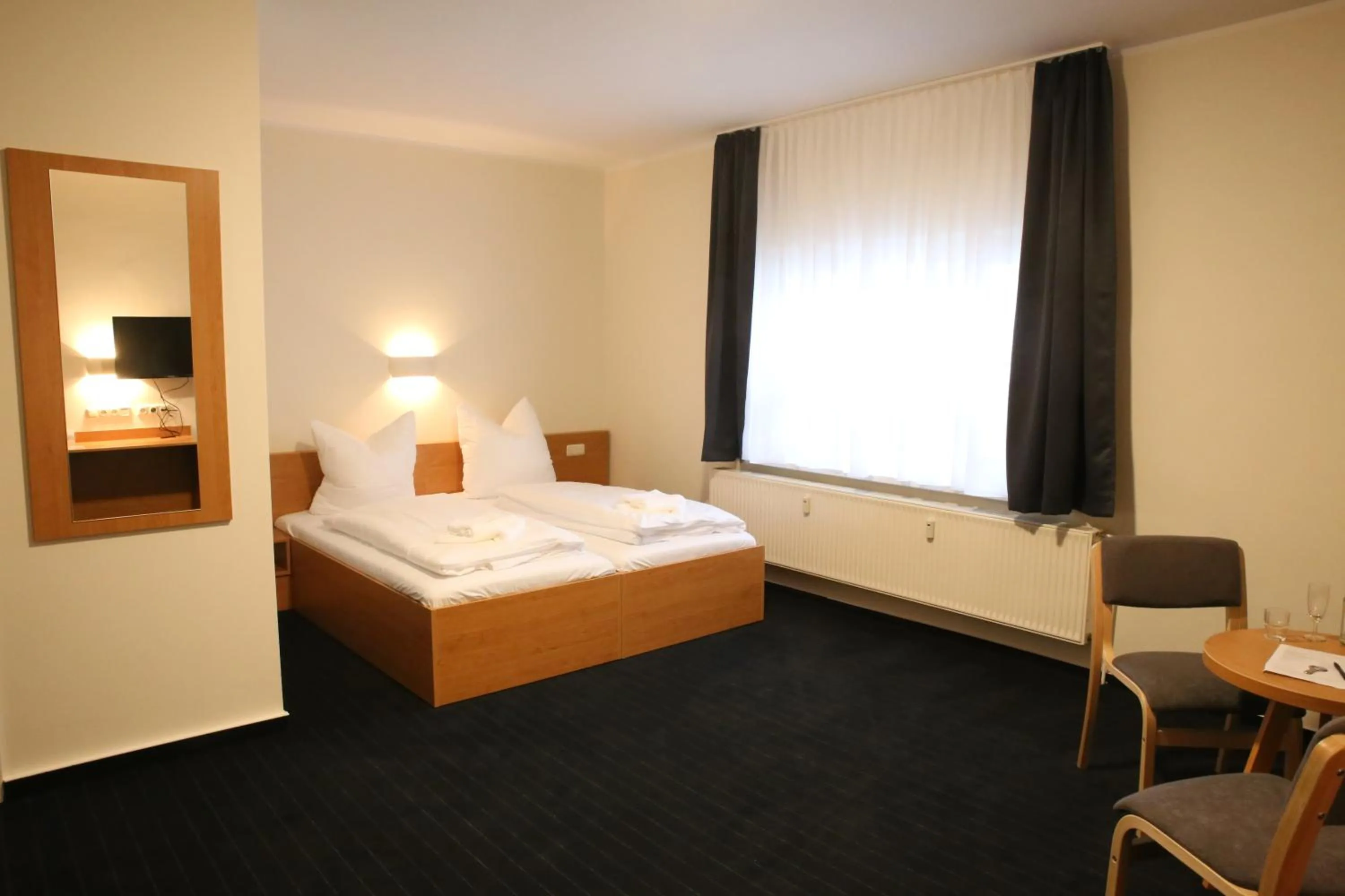 Photo of the whole room, Bed in City-Pension Magdeburg