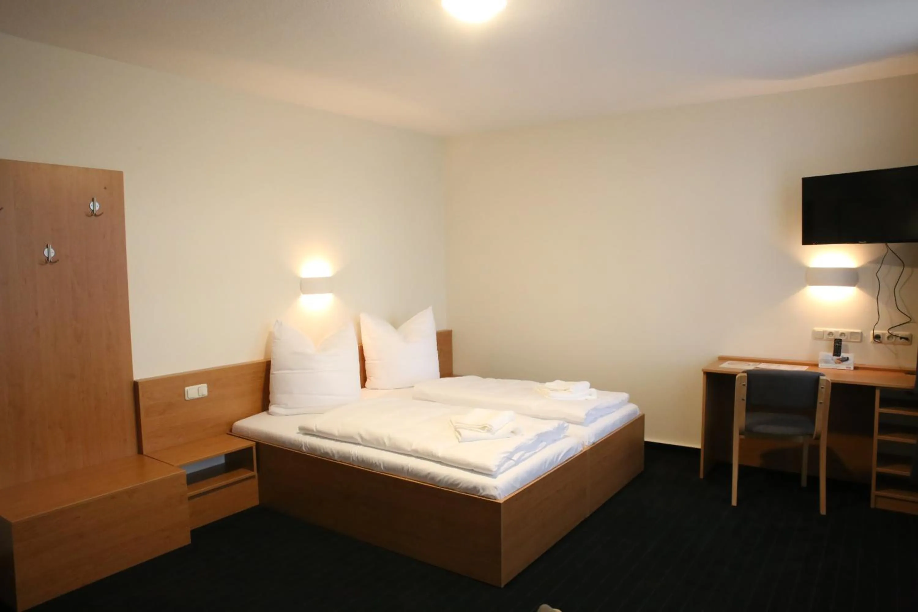 Photo of the whole room, Bed in City-Pension Magdeburg