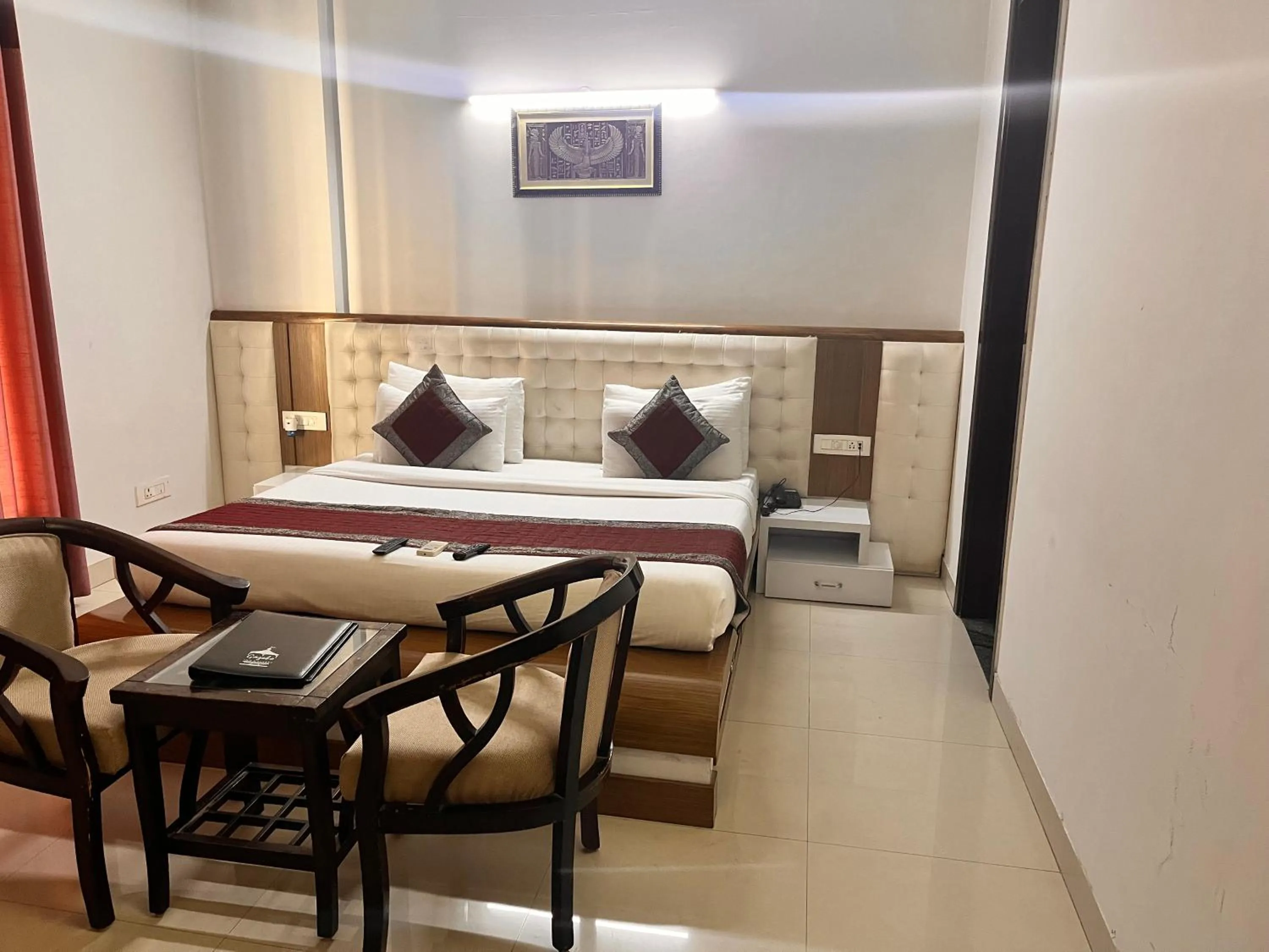 Dining area, Bed in Gazebo Inn & Suites Medanta