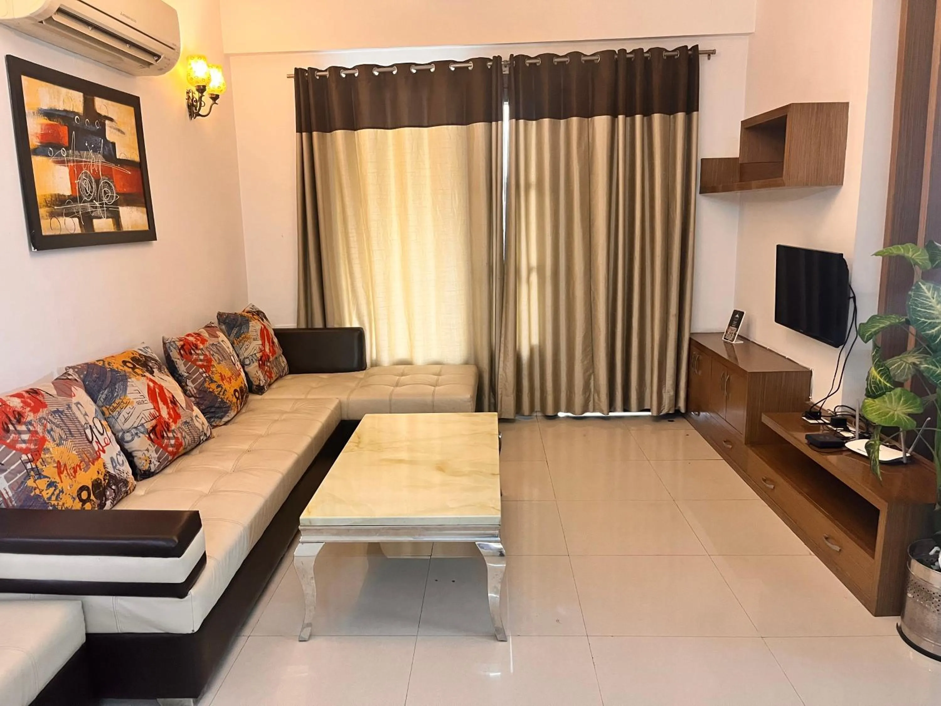 Seating area, Bed in Gazebo Inn & Suites Medanta