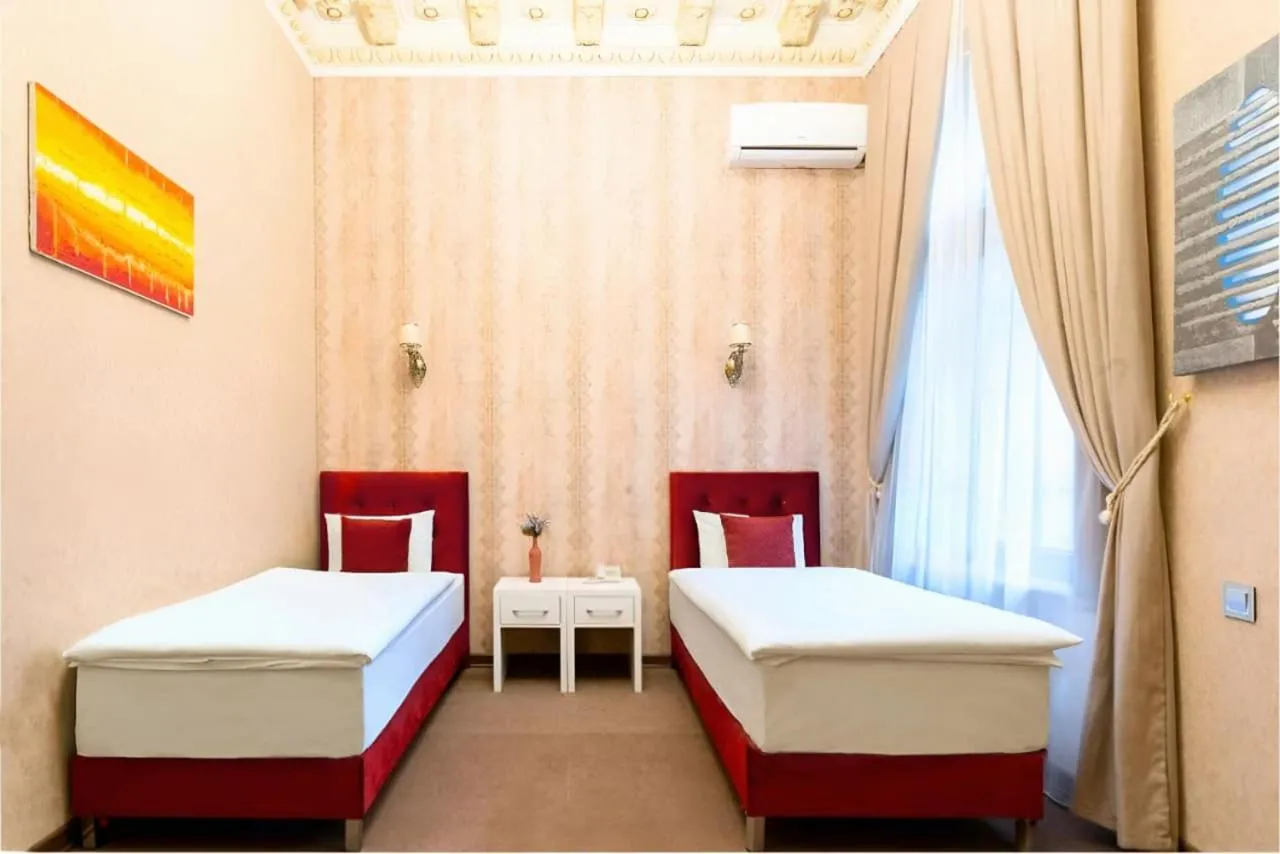 Bed in Nizami Boutique Hotel