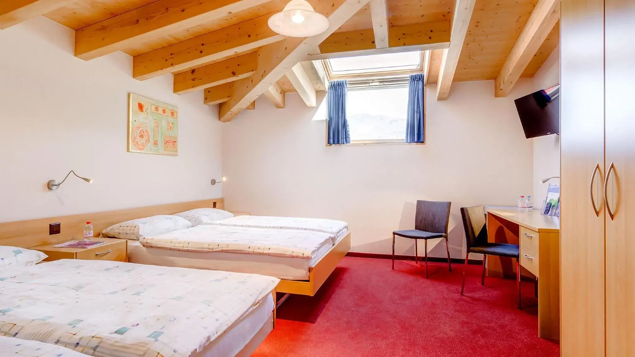 Attic Quadruple Room in Hotel La Perla Attic Quadruple Room in Hotel La Perla