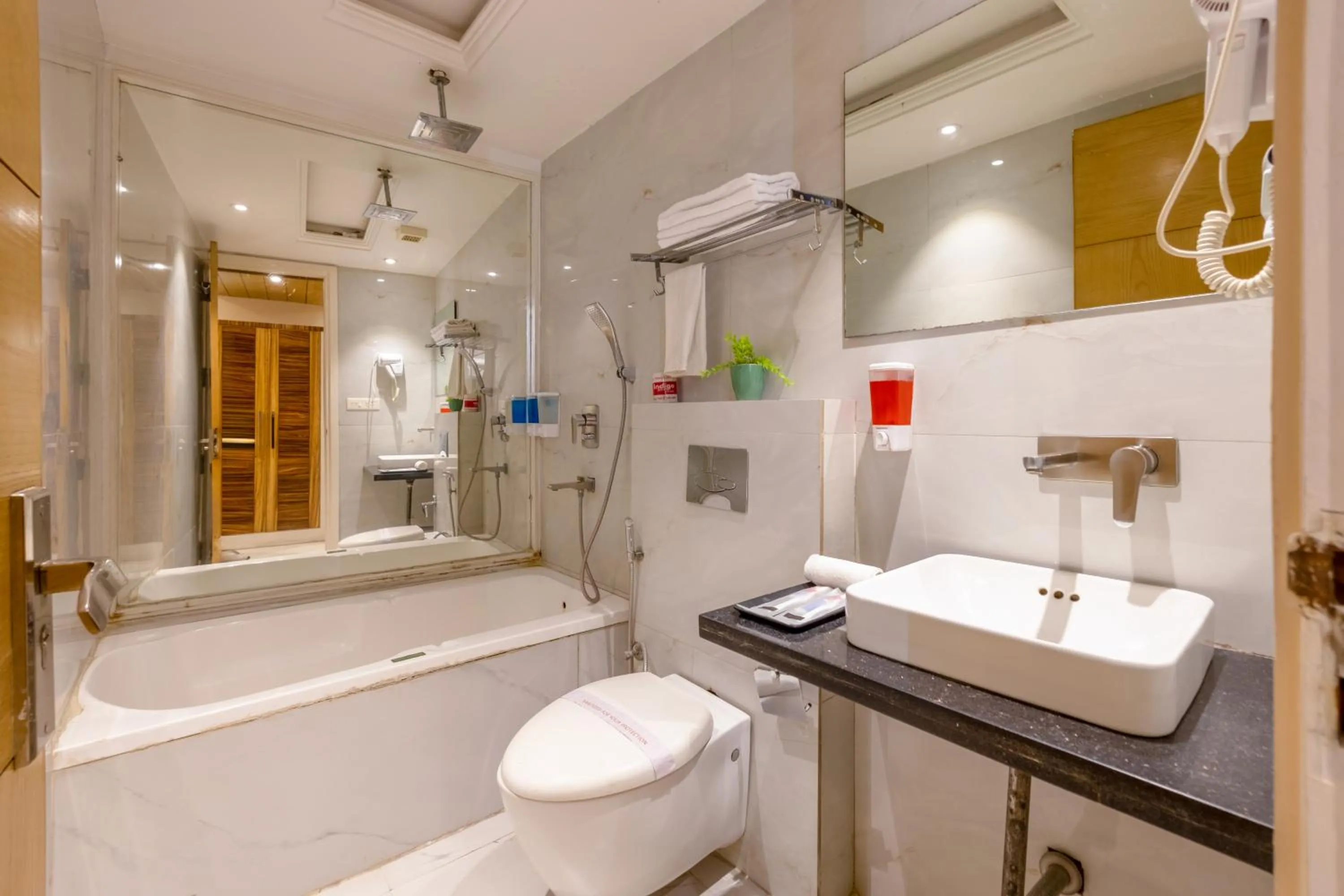 Shower in Aman Continental With Restaurant - 5Mins from Connaught Place ,Railway Station & Metro