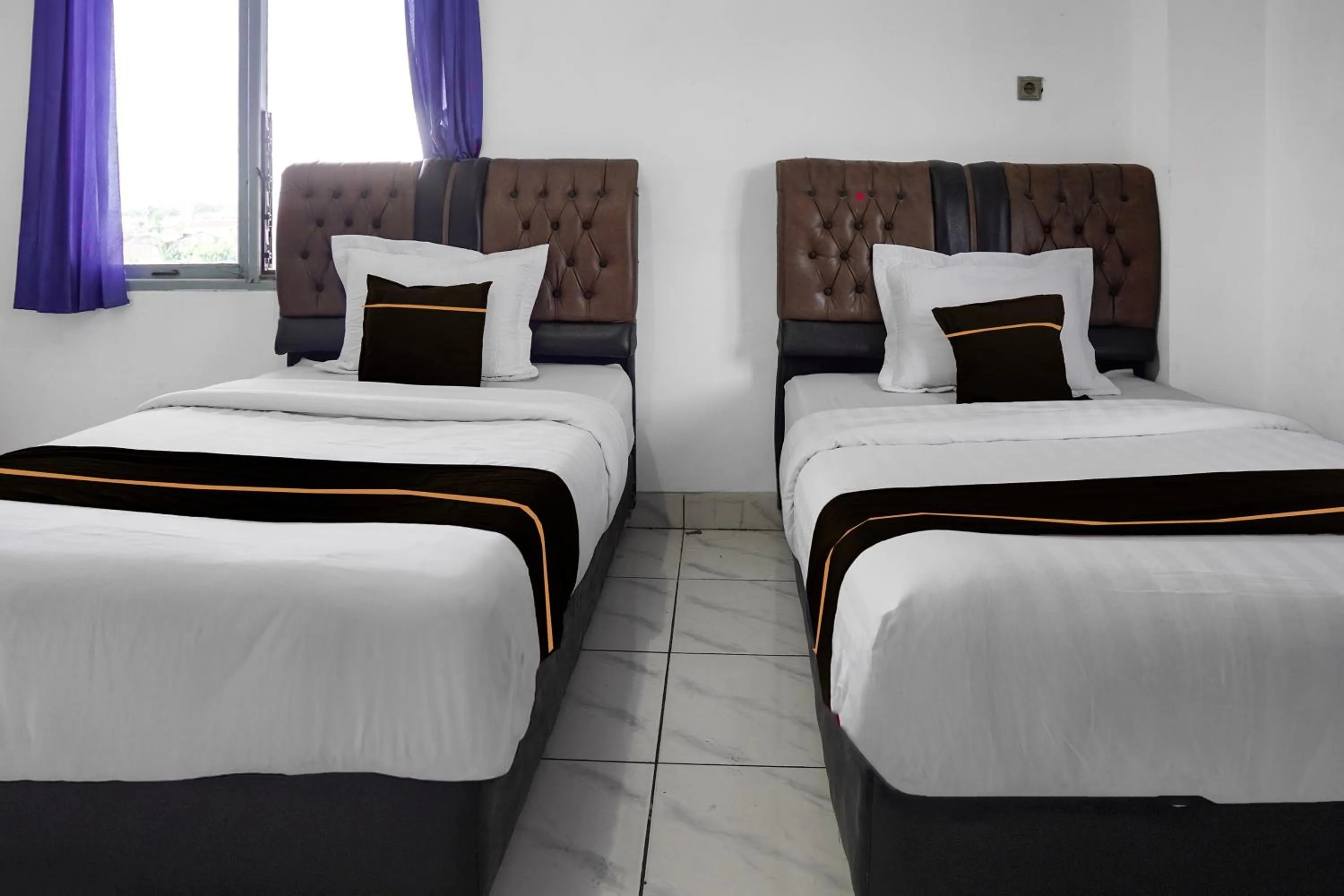 Bedroom, Bed in Collection O near Universitas Negeri Padang formerly Hotel Amra