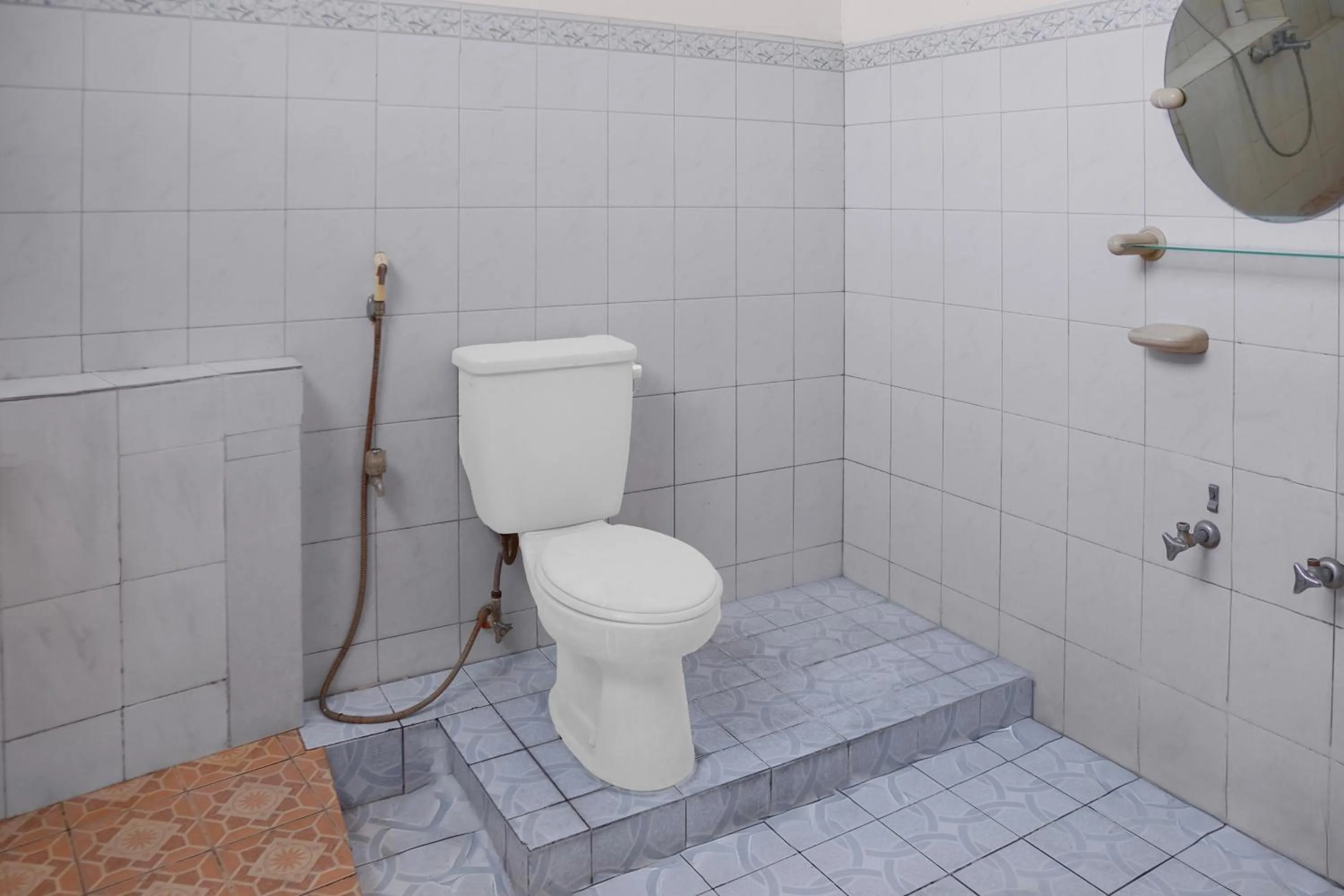 Bathroom in Collection O near Universitas Negeri Padang formerly Hotel Amra