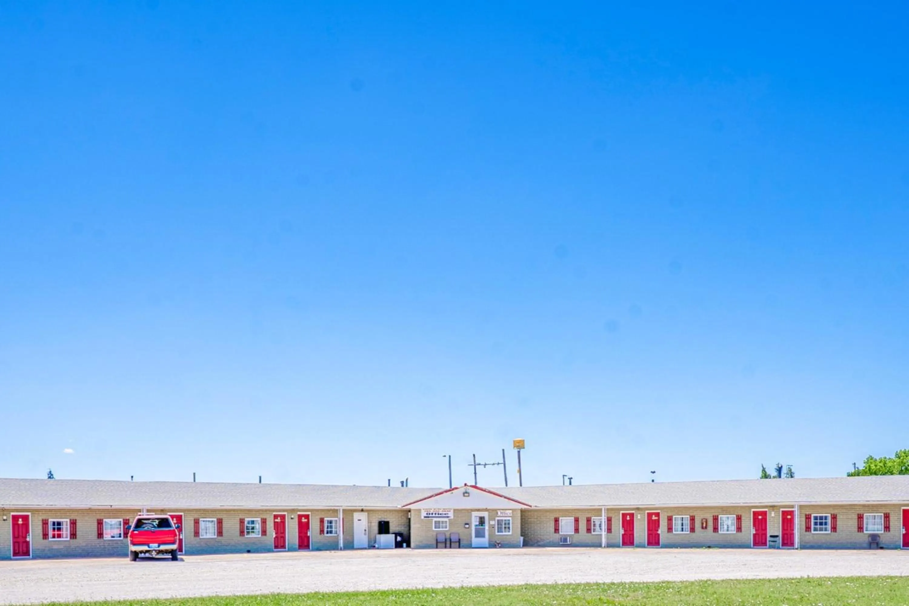 Property building in Green Acre Motel by OYO Near Rush County Airport