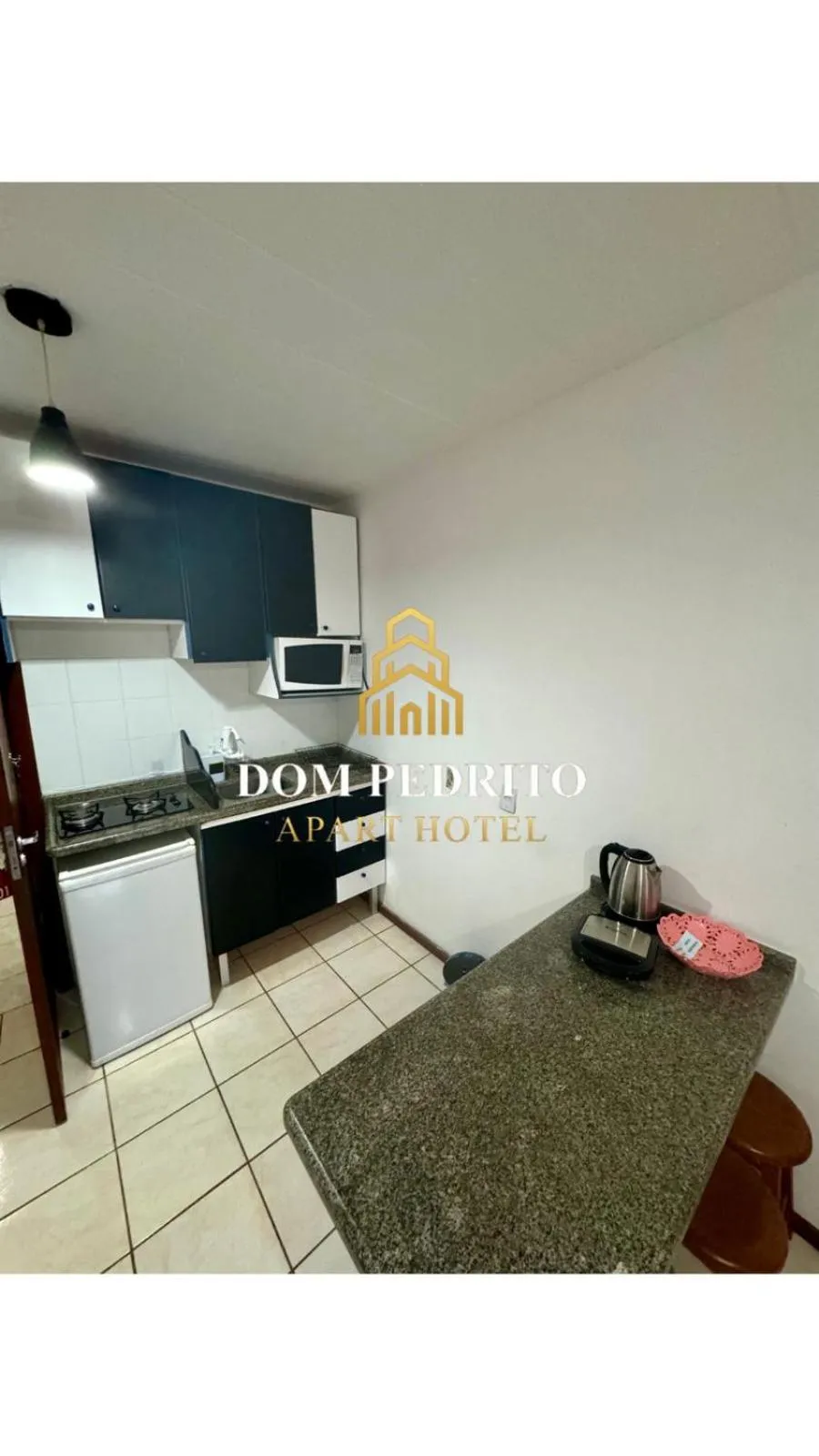 Kitchen or kitchenette in Dom Pedrito Apart Hotel