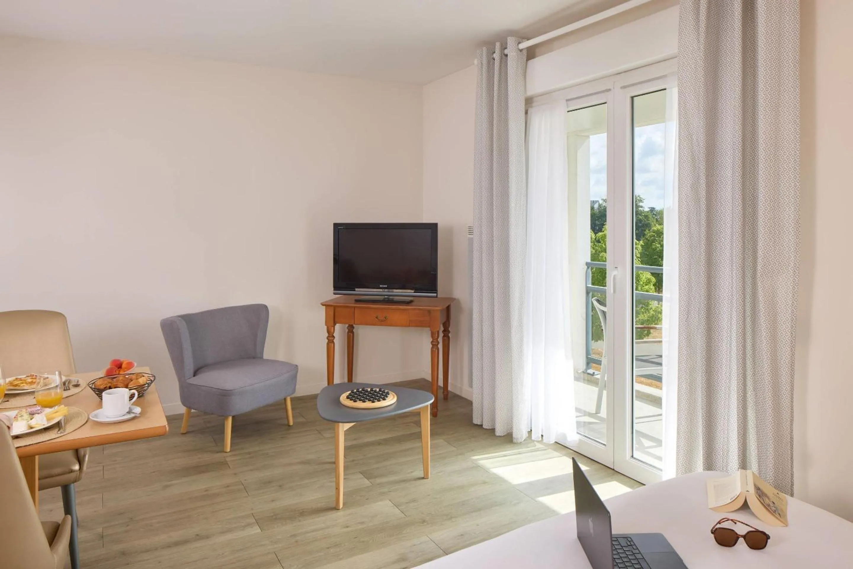 Living room in Quality Aparthotel Portes de Rennes