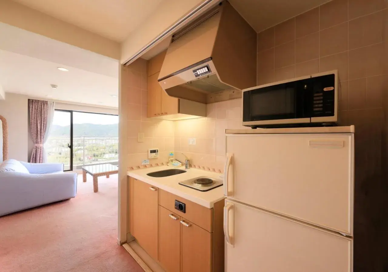 Kitchen or kitchenette, Bed in Kamogawa Grand Tower Kitchen or kitchenette, Bed in Kamogawa Grand Tower