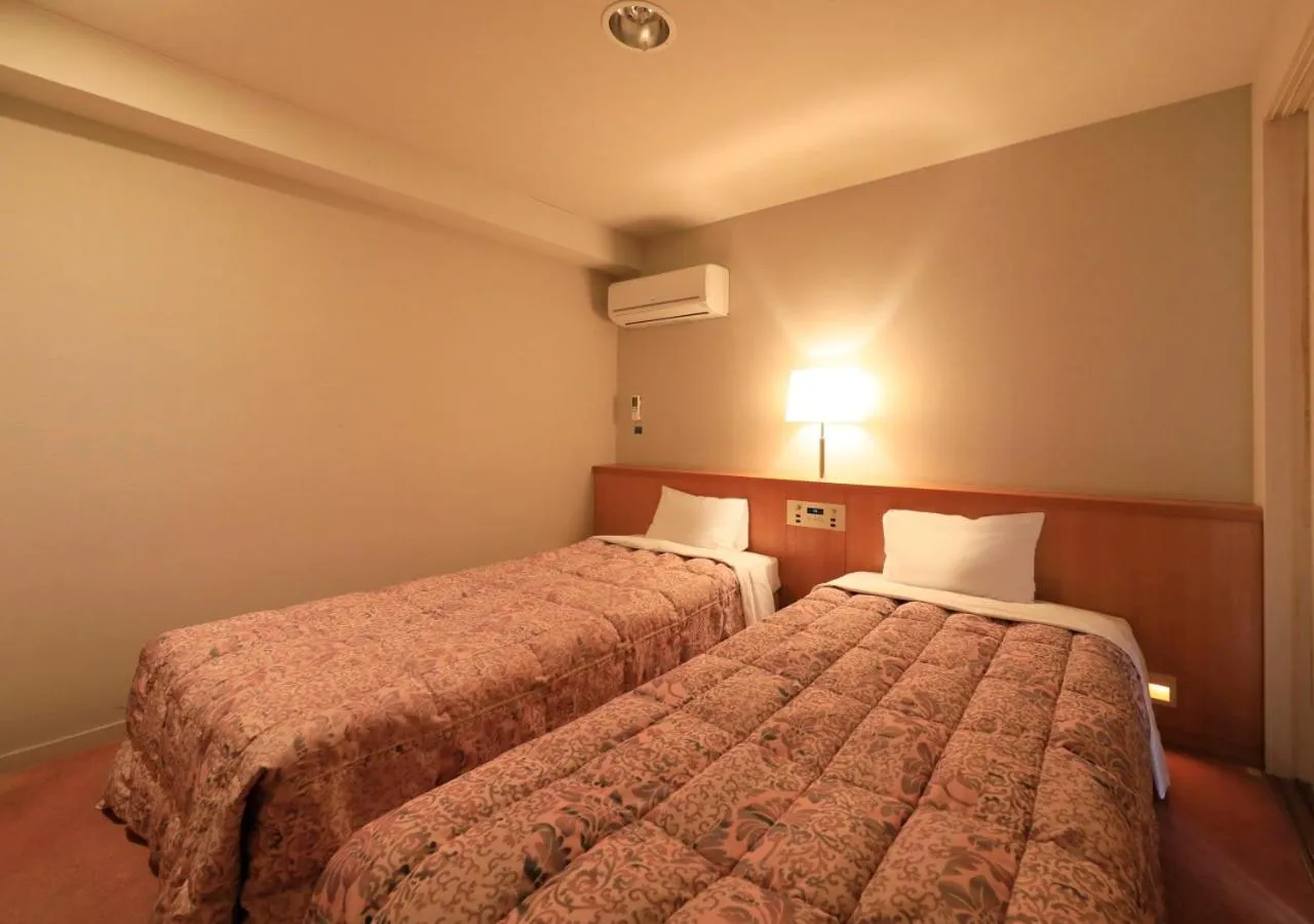 Bed in Kamogawa Grand Tower