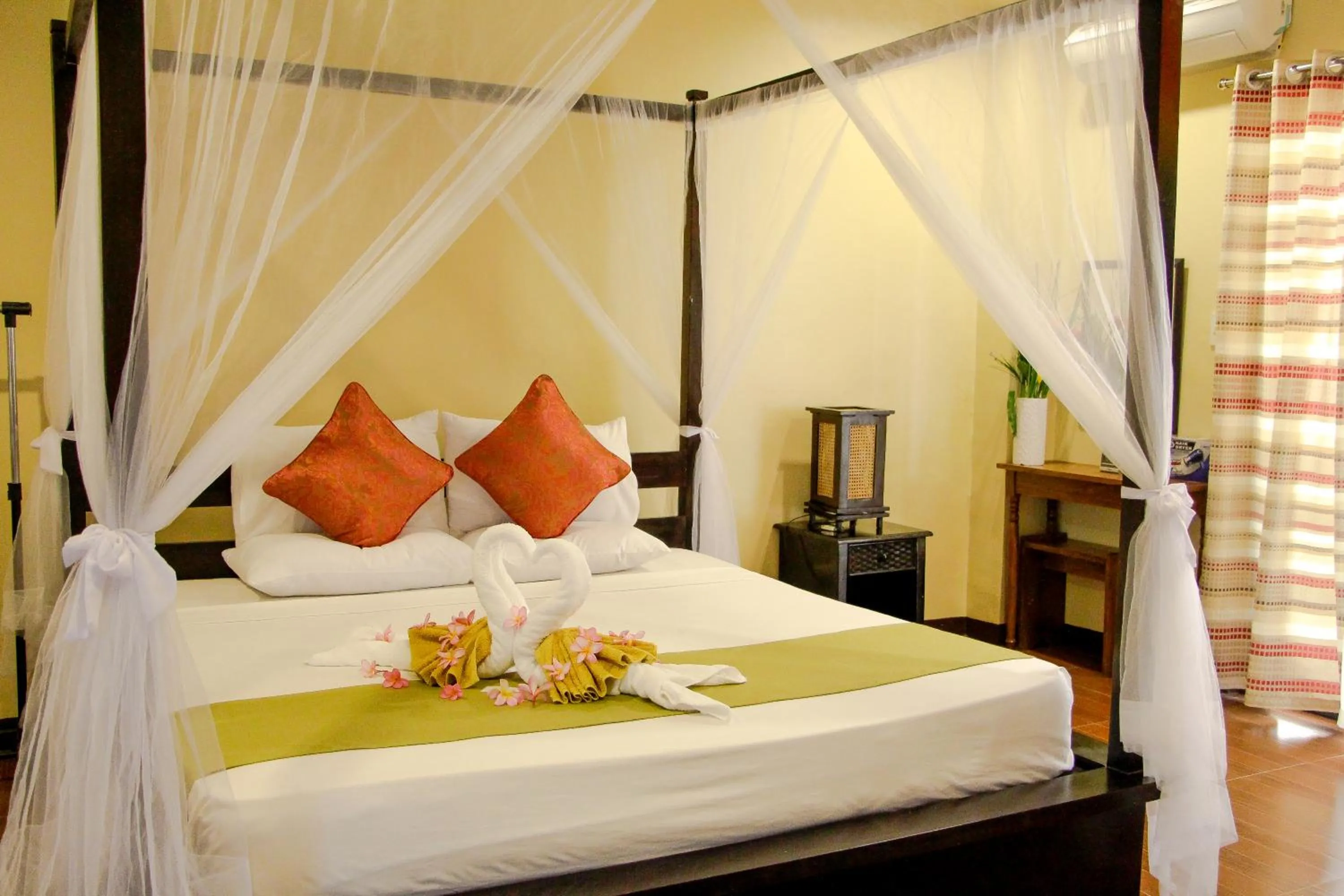 Bed in Sulu Sea Boutique Hotel