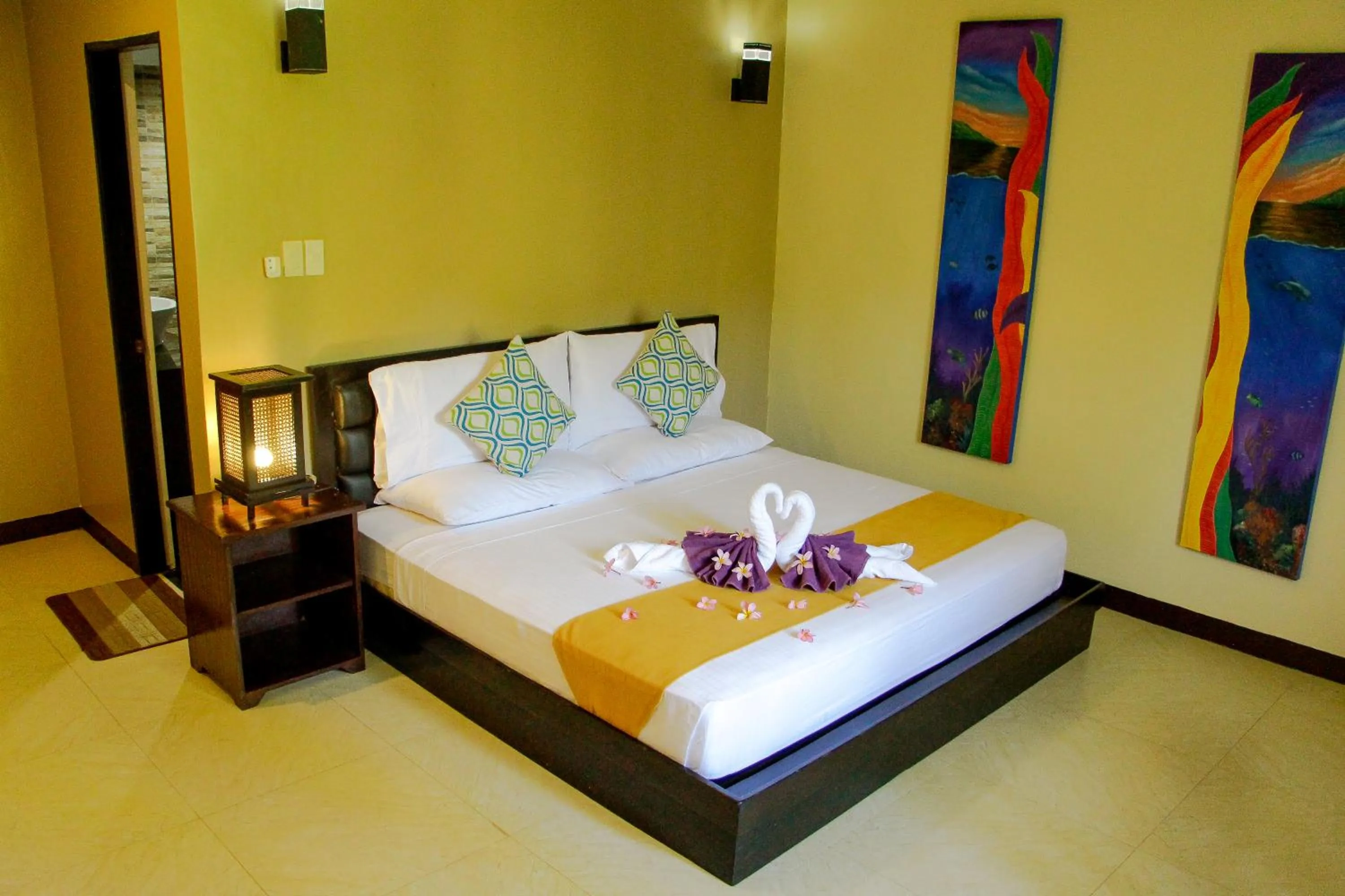 Bed in Sulu Sea Boutique Hotel