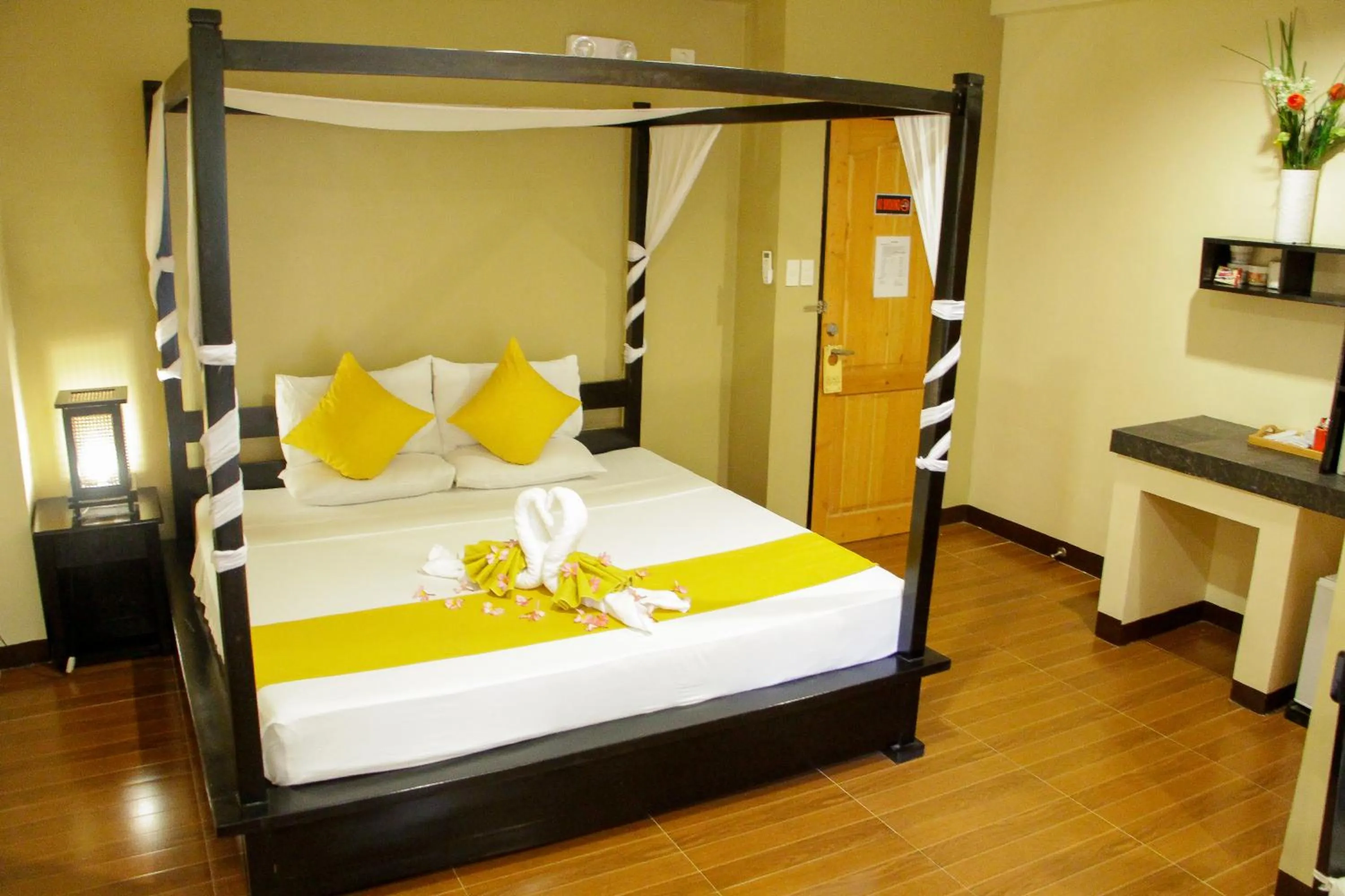 Bed in Sulu Sea Boutique Hotel