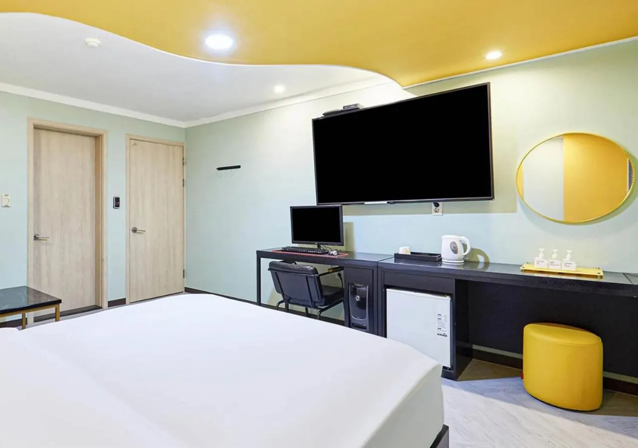 Bed in Waikei Hotel
