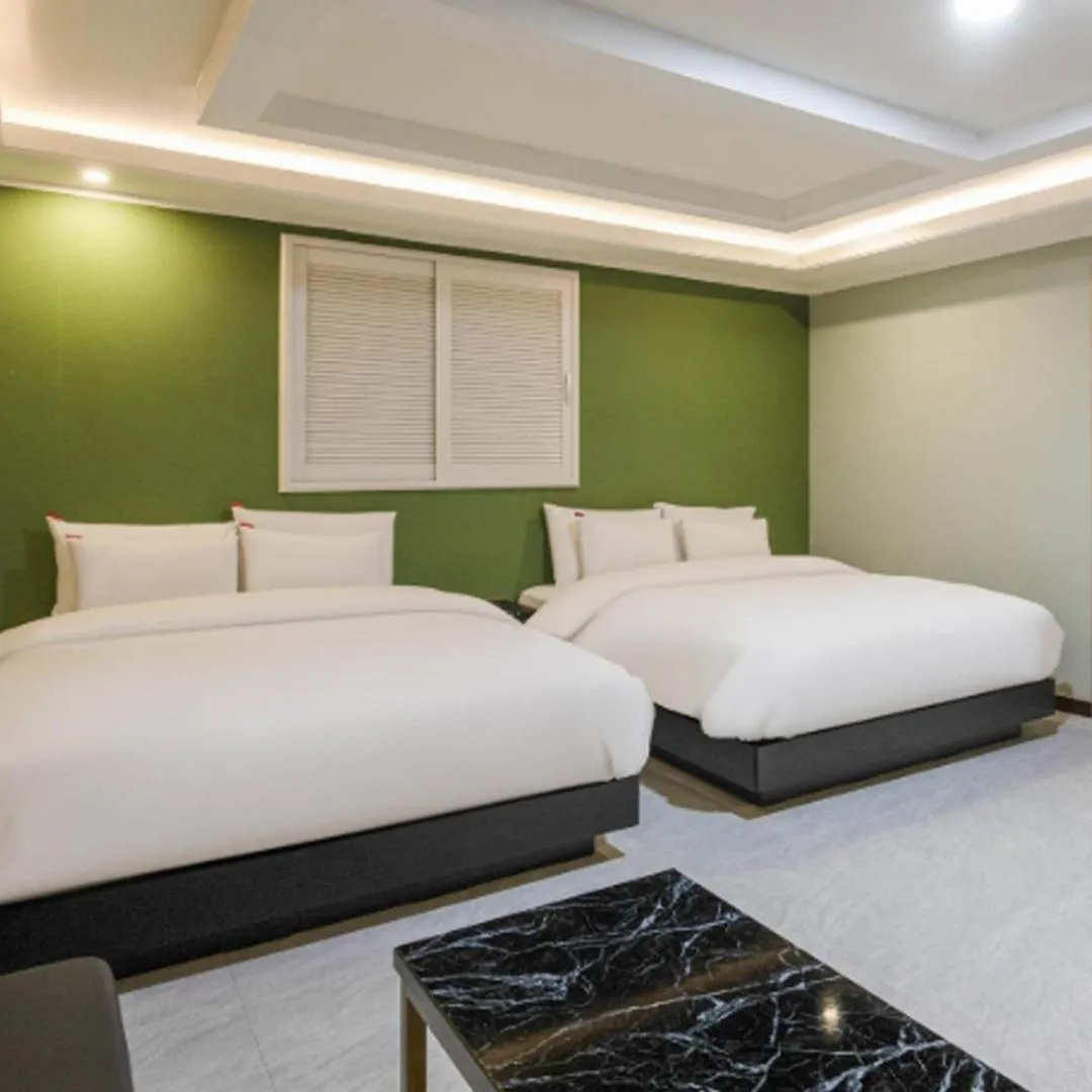 Bed in Waikei Hotel