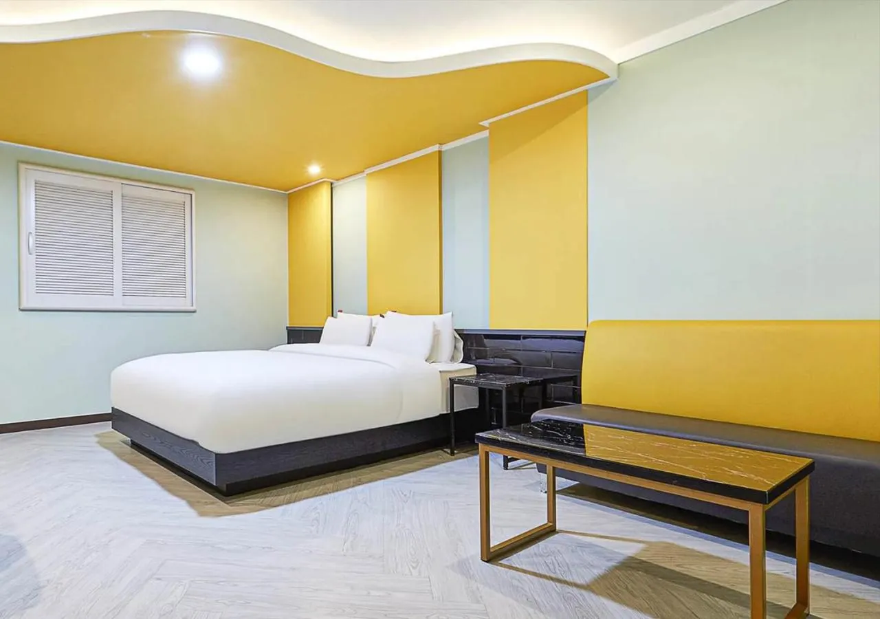 Bed in Waikei Hotel