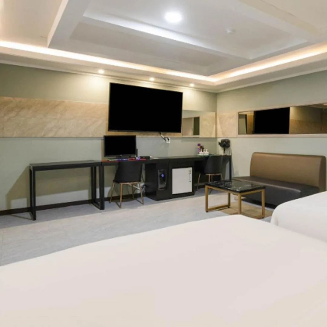 Bed in Waikei Hotel