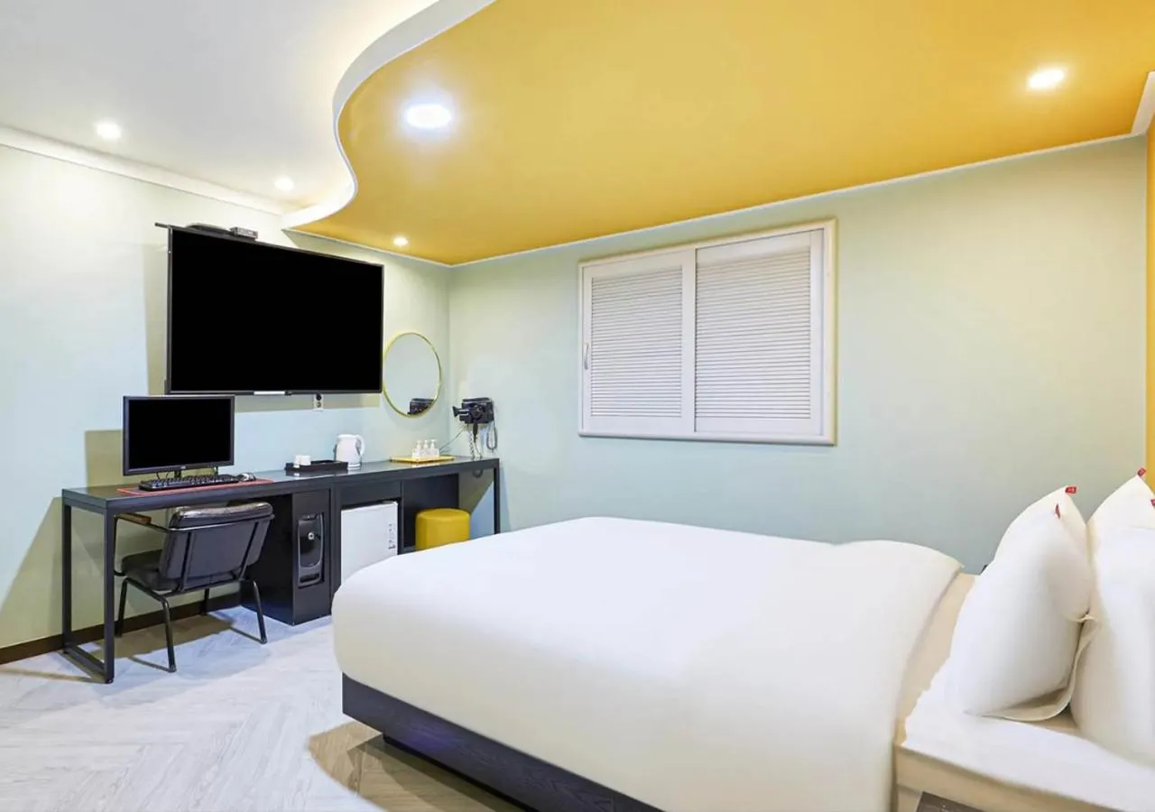 Bed in Waikei Hotel