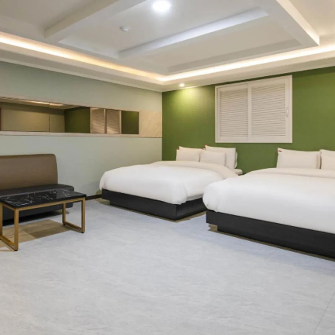 Bed in Waikei Hotel