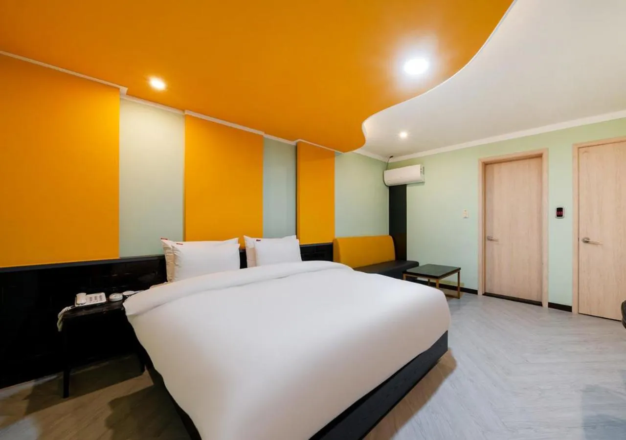 Bed in Waikei Hotel