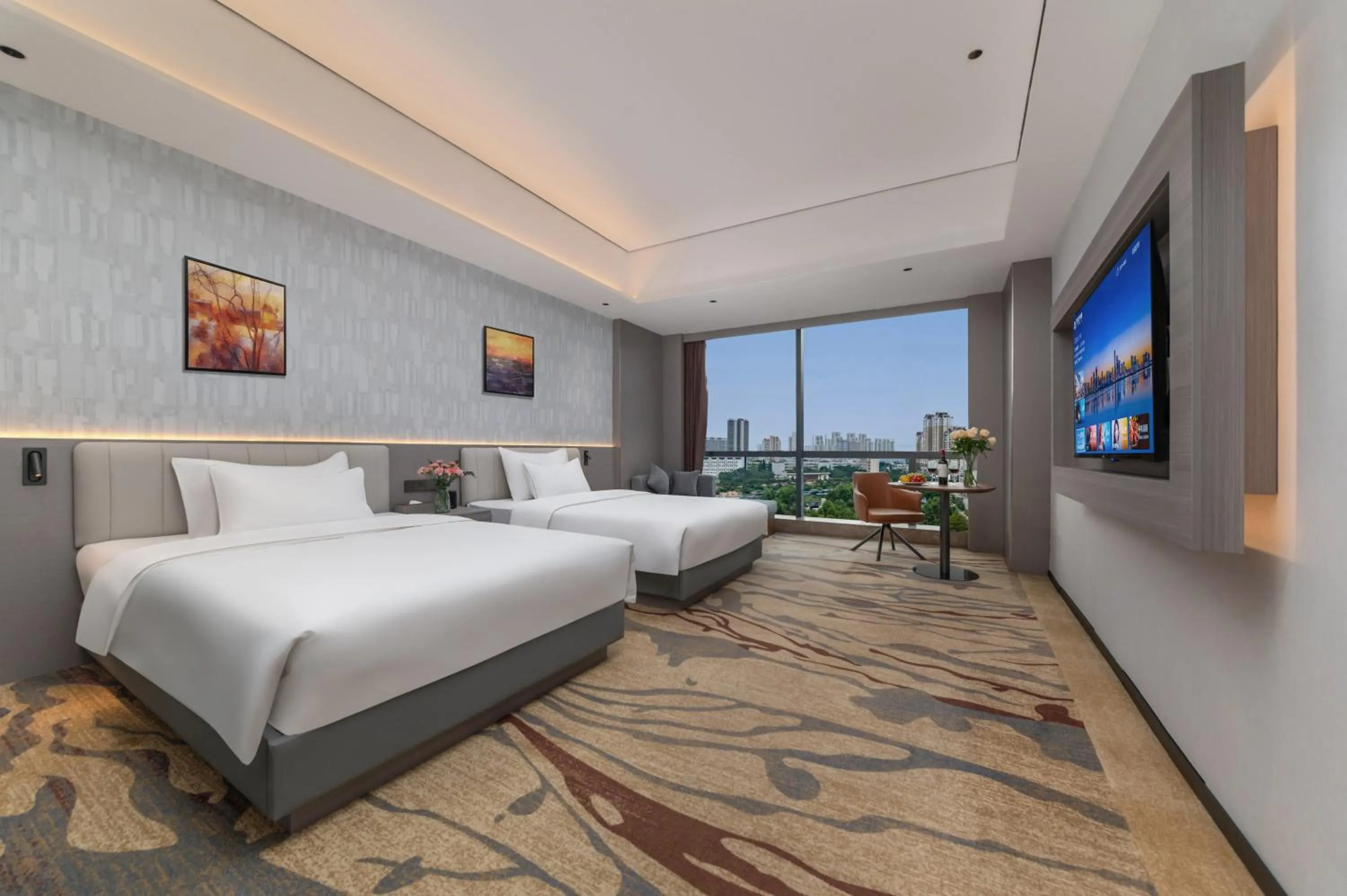 Communal lounge/ TV room, Bed in Treasure Island Hotel HUMEN