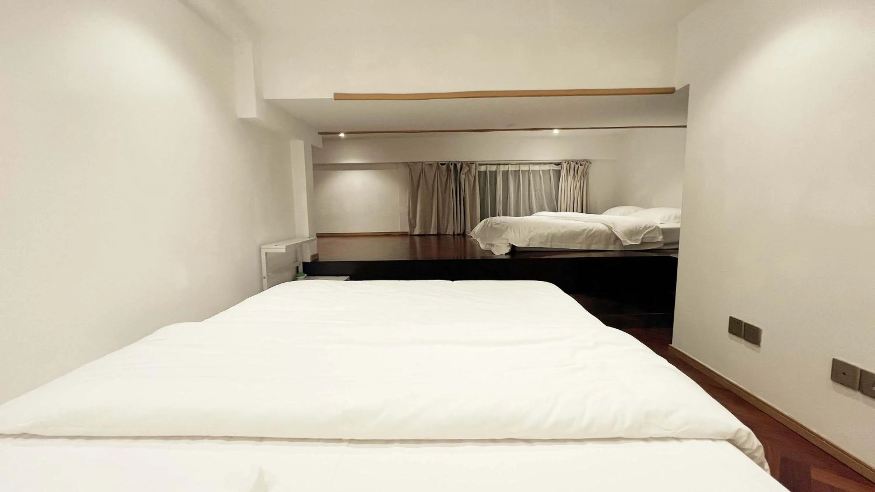 Bed in Hongqiao Aegean Sea LOFT Apartment